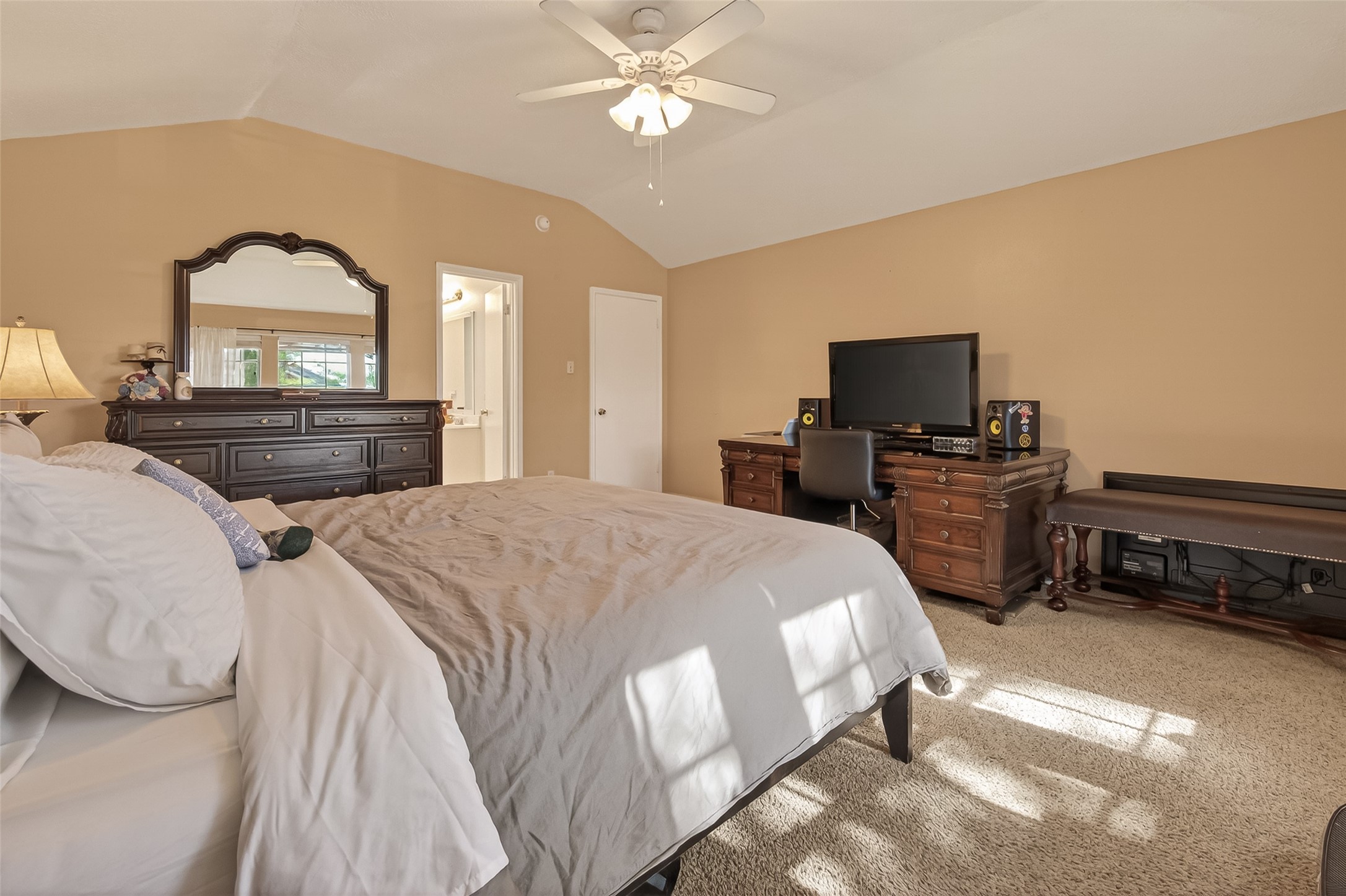 7315 Tara Blue Ridge Drive Richmond, TX 77469 - Photo 25 of 45 a spacious bedroom with a bed and a flat screen tv