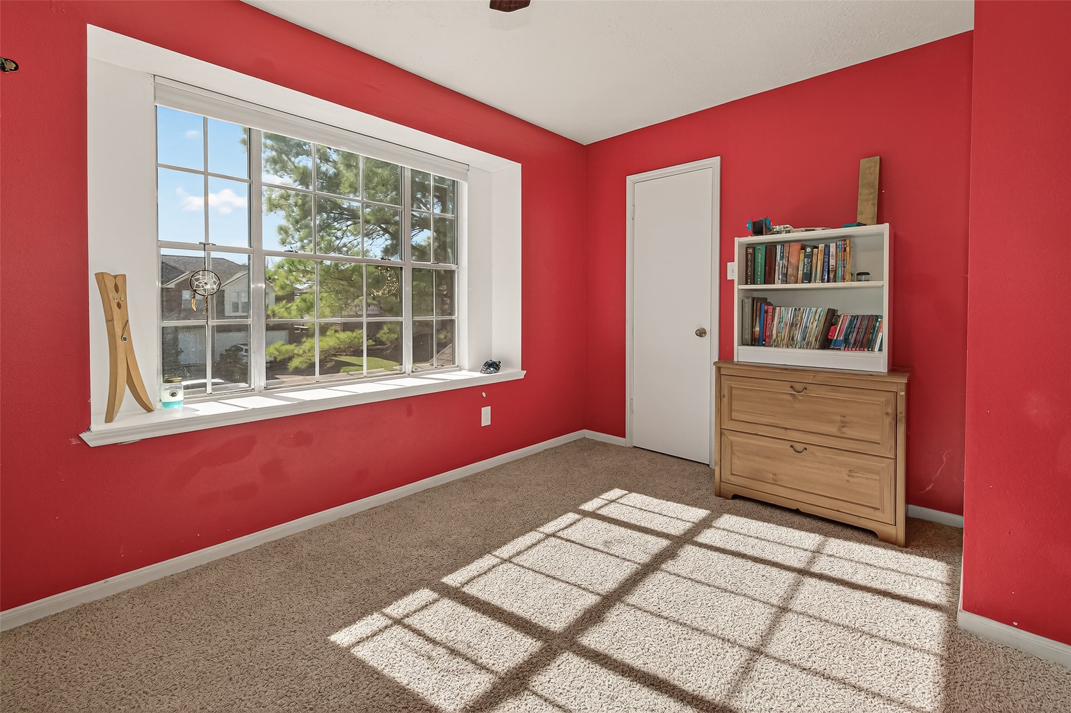 7315 Tara Blue Ridge Drive Richmond, TX 77469 - Photo 34 of 45 a view of a bedroom with wooden floor and cabinet