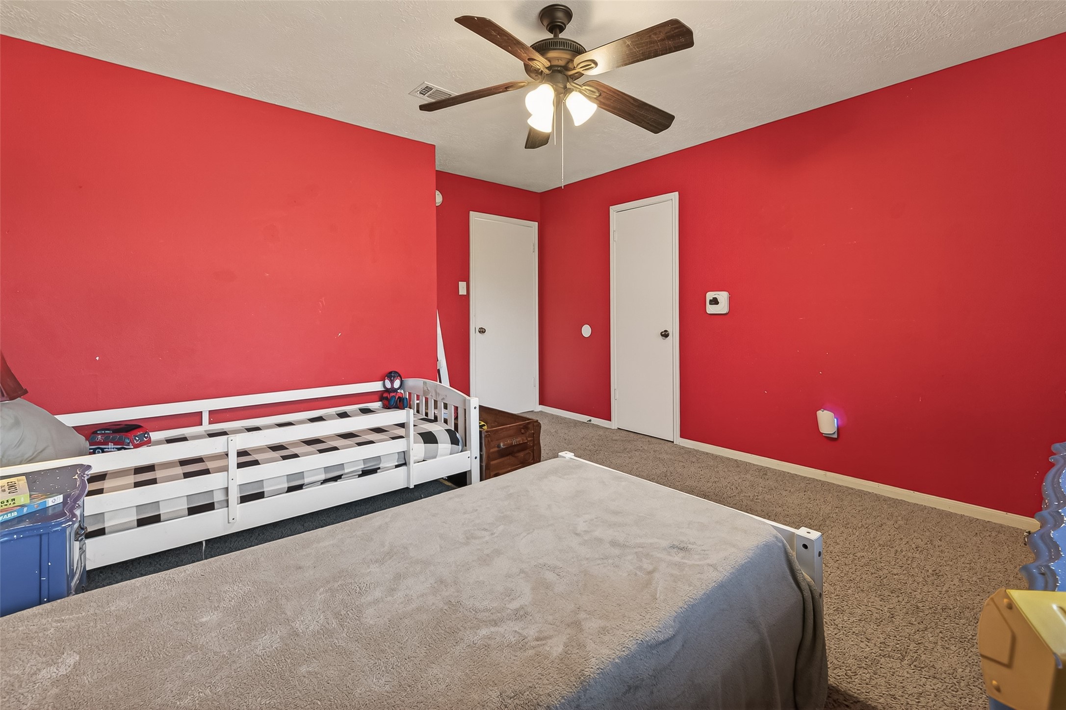 7315 Tara Blue Ridge Drive Richmond, TX 77469 - Photo 36 of 45 a bed room with a bed and a ceiling fan