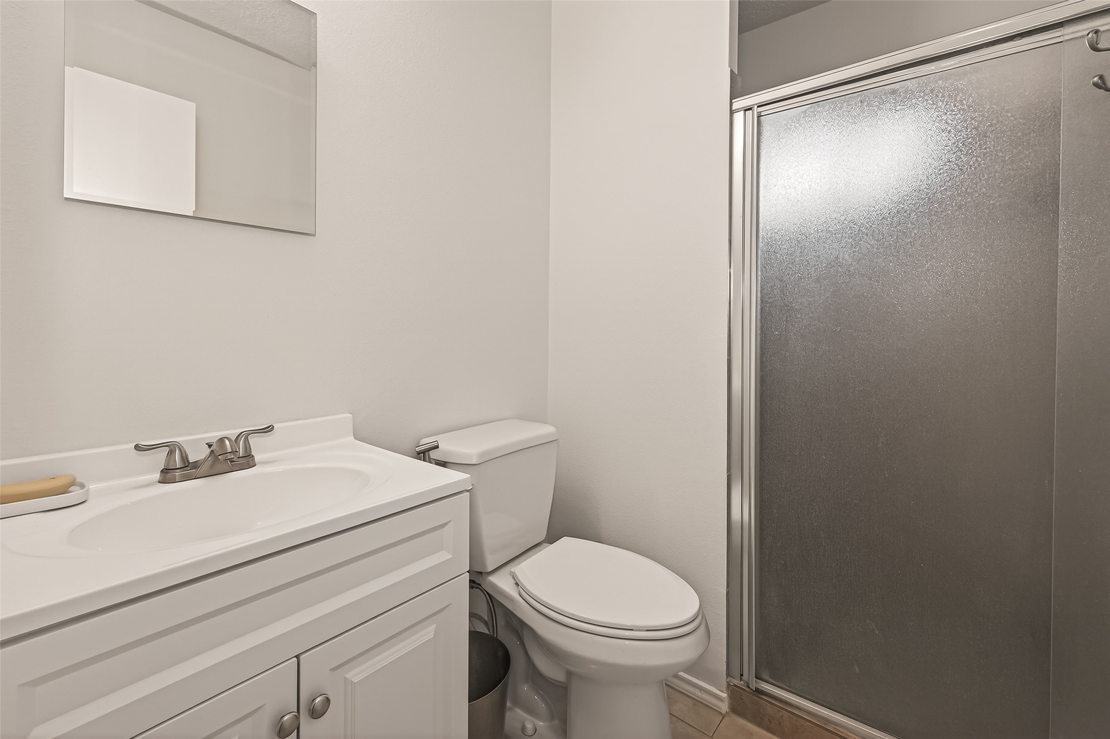 7315 Tara Blue Ridge Drive Richmond, TX 77469 - Photo 37 of 45 a white toilet sitting next to a bathroom sink