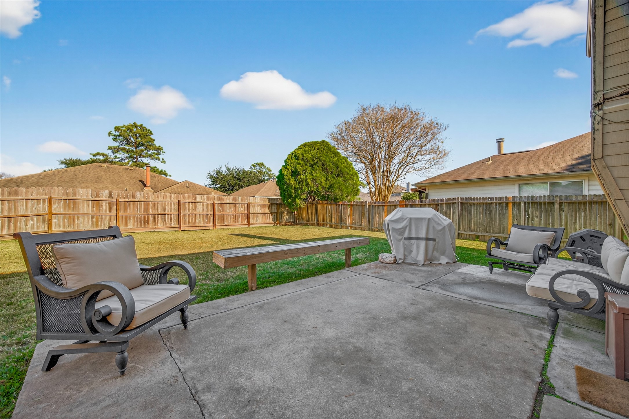 7315 Tara Blue Ridge Drive Richmond, TX 77469 - Photo 38 of 45 a view of a backyard with table and chairs