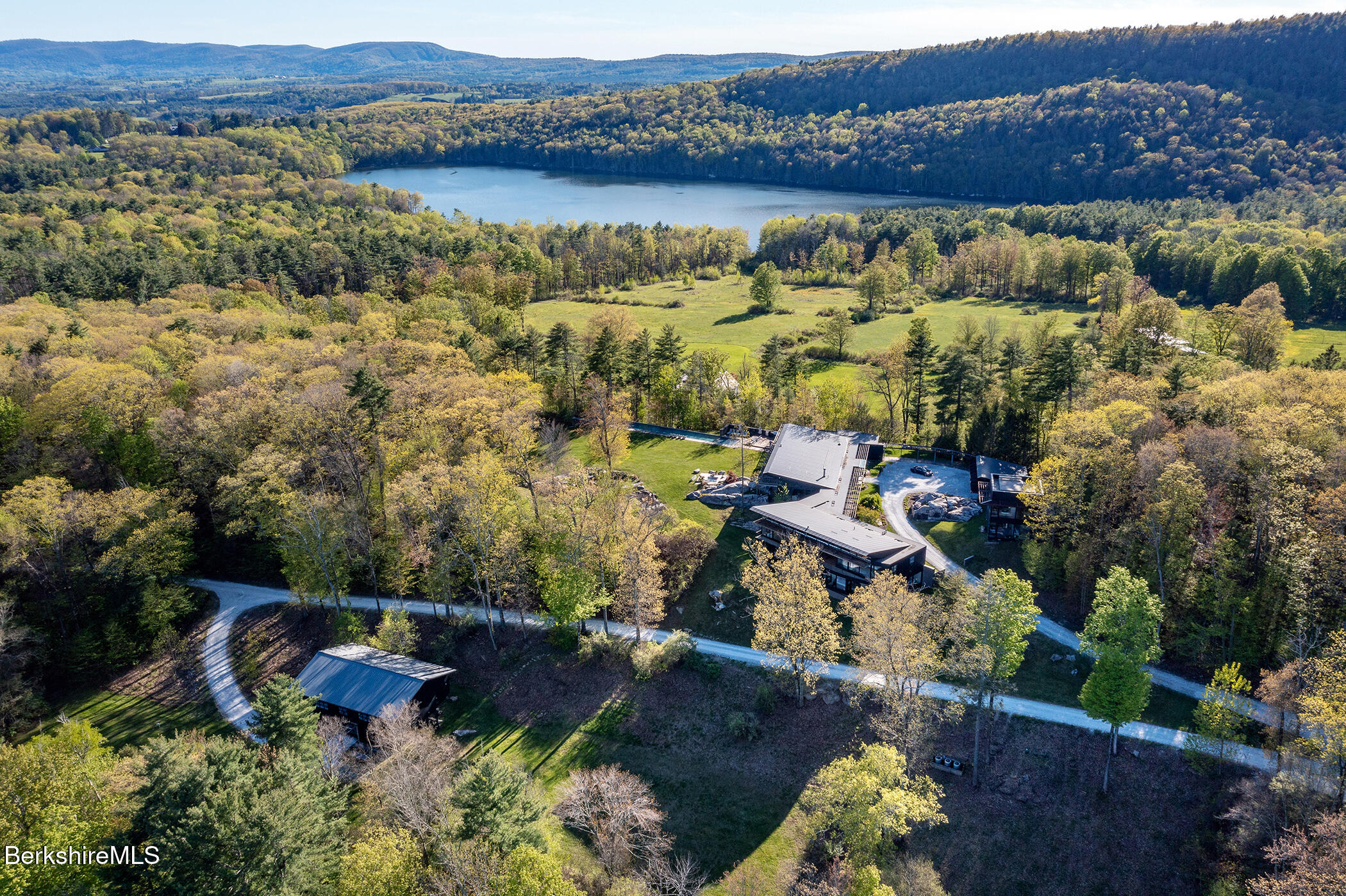 250 Long Pond Road Great Barrington, MA 01230 - Photo 56 of 56 an aerial view of a house with a lake view