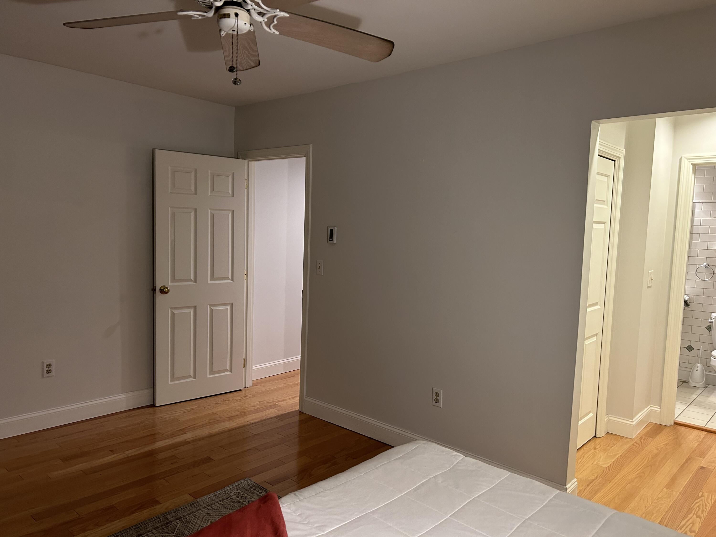 48 Camp Street, Unit 9 Hyannis, MA 02601 - Photo 16 of 42 a view of an empty room with wooden floor and a window