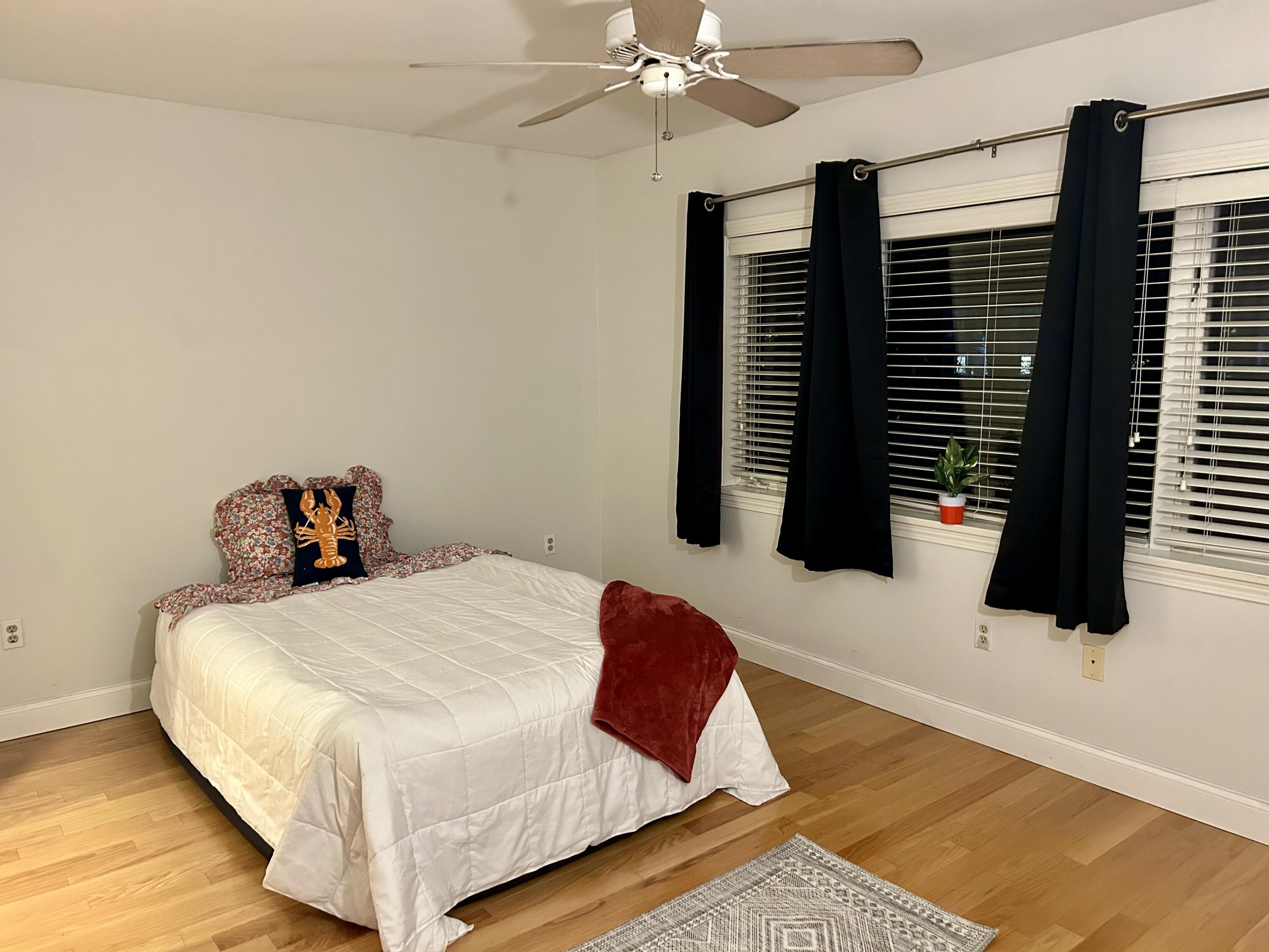 48 Camp Street, Unit 9 Hyannis, MA 02601 - Photo 17 of 42 a bedroom with a bed and a walk in closet