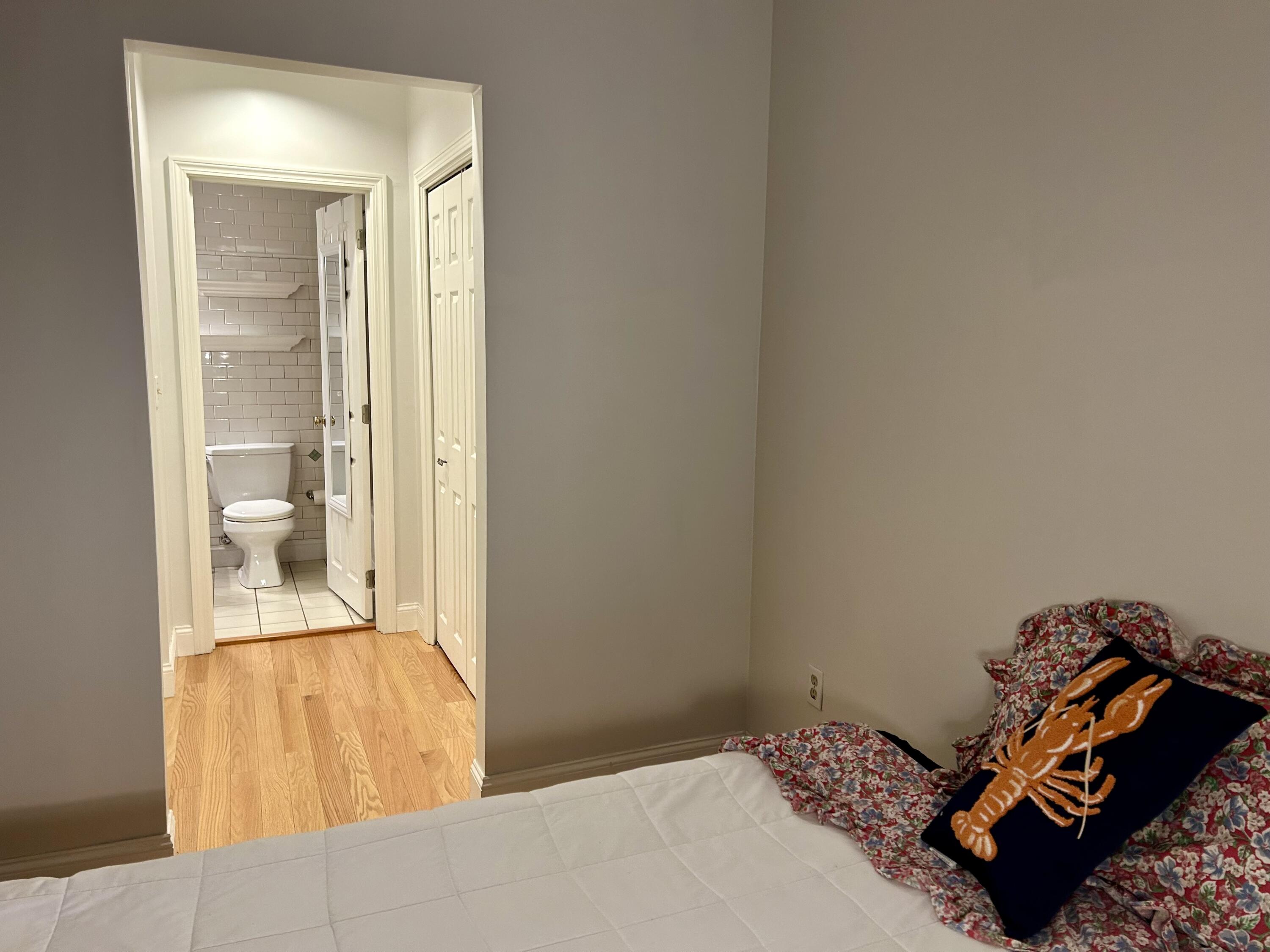 48 Camp Street, Unit 9 Hyannis, MA 02601 - Photo 19 of 42 a bedroom with a bed and a mirror