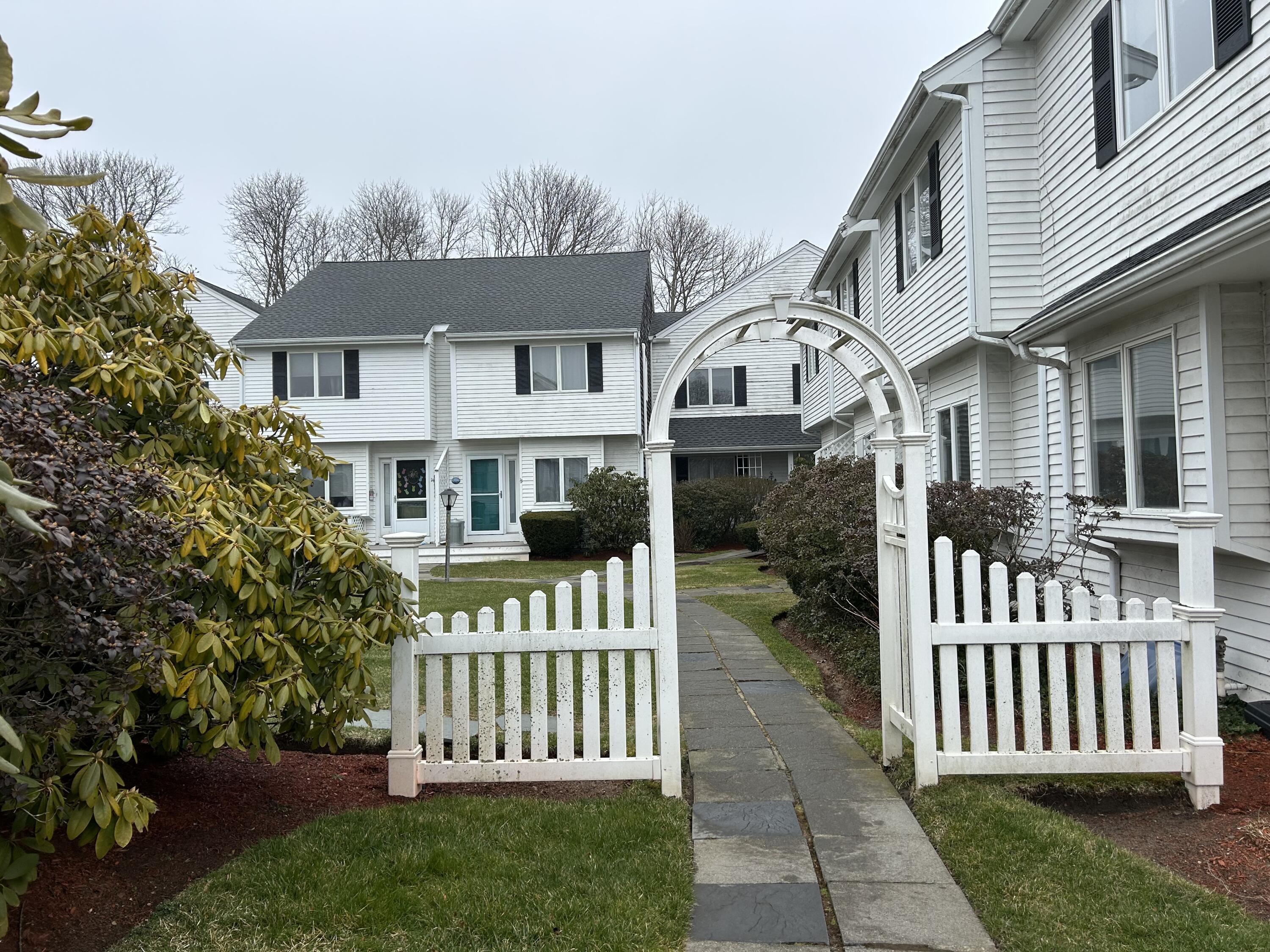 48 Camp Street, Unit 9 Hyannis, MA 02601 - Photo 2 of 42 a front view of a house with a garden