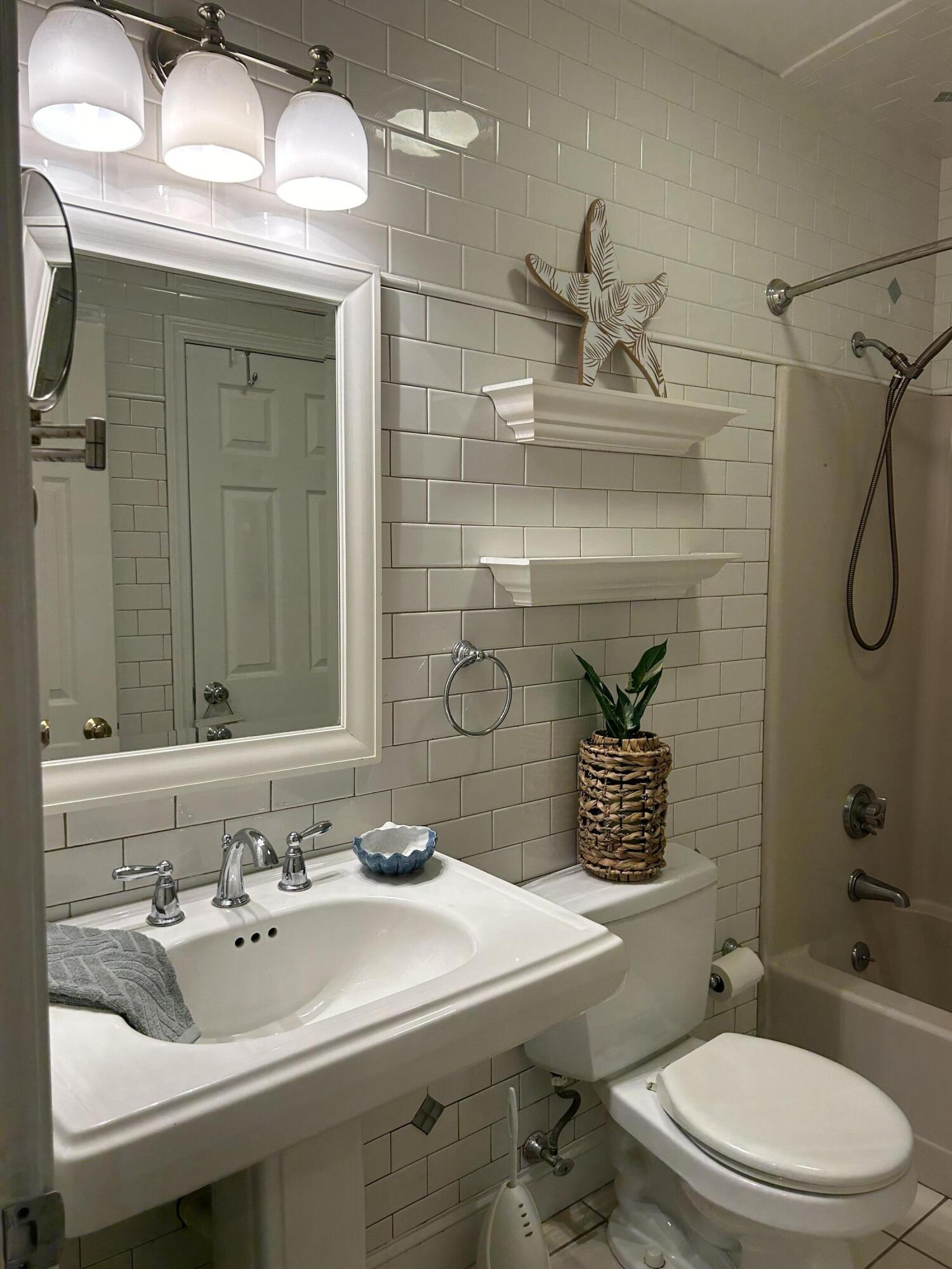 48 Camp Street, Unit 9 Hyannis, MA 02601 - Photo 23 of 42 a bathroom with a sink a toilet and shower
