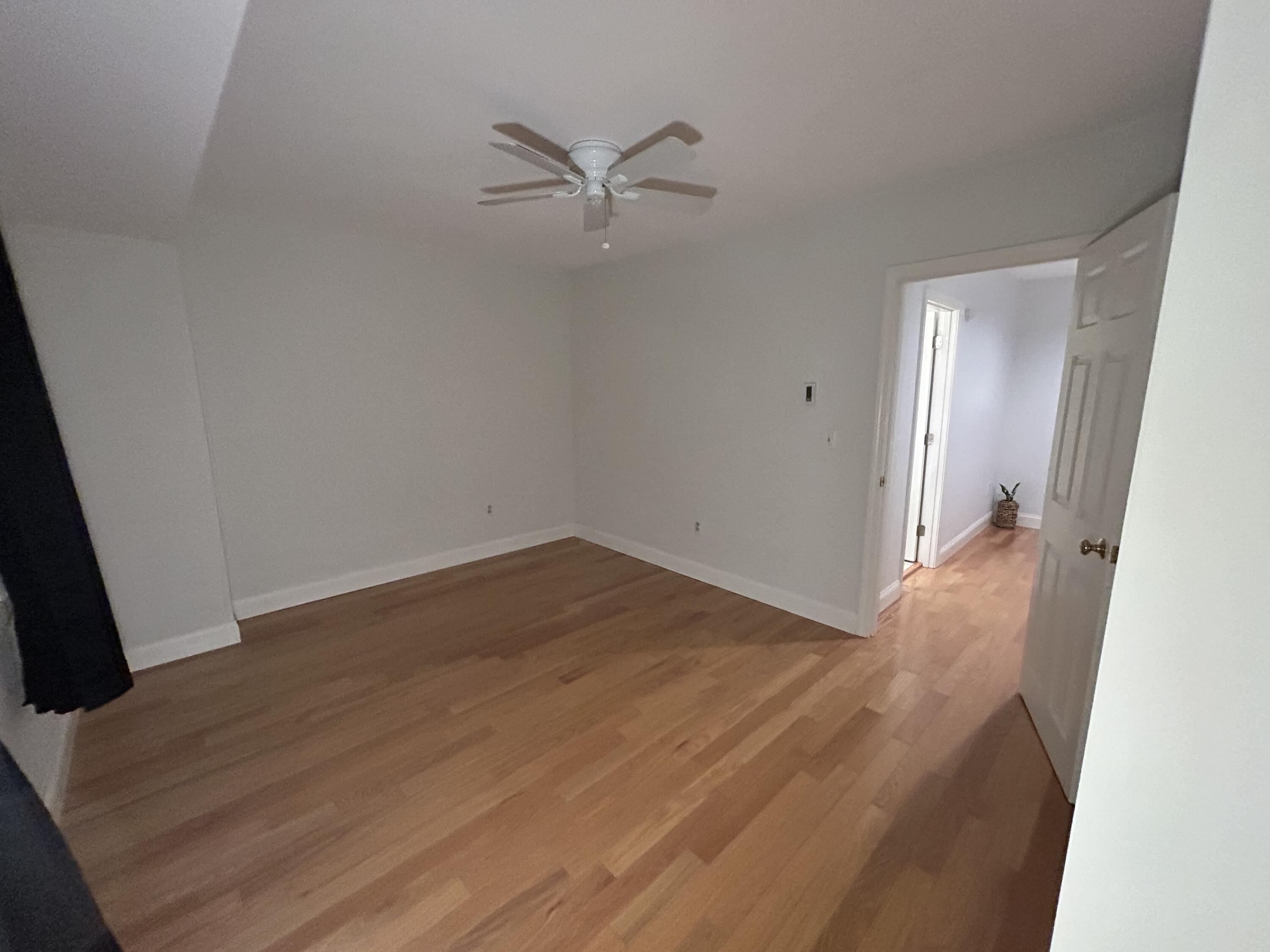 48 Camp Street, Unit 9 Hyannis, MA 02601 - Photo 25 of 42 wooden floor in an empty room
