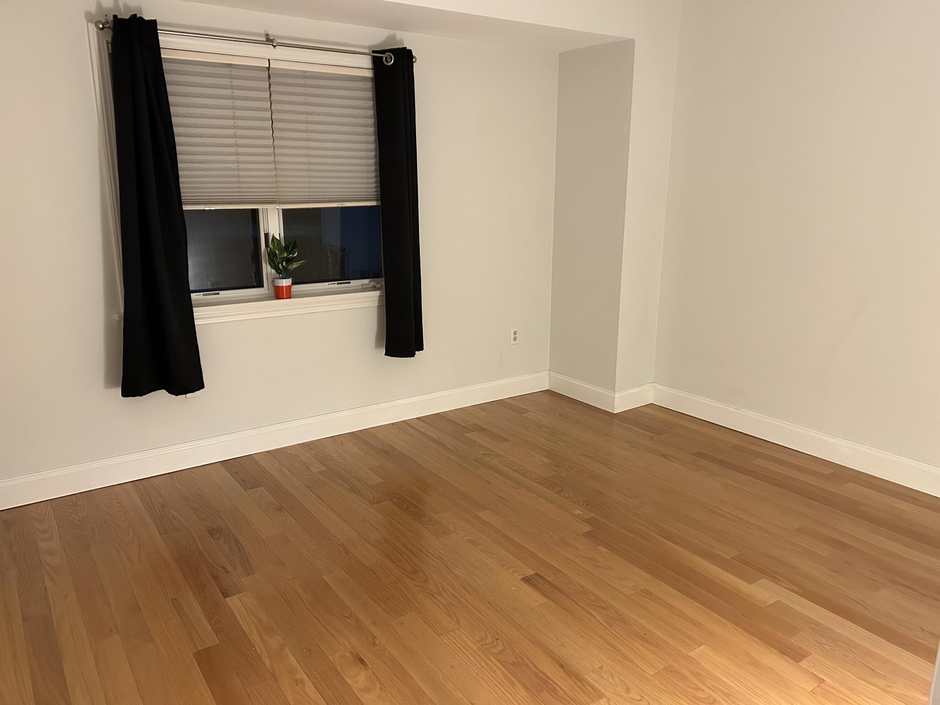 48 Camp Street, Unit 9 Hyannis, MA 02601 - Photo 26 of 42 a view of a bedroom with wooden floor and a sink