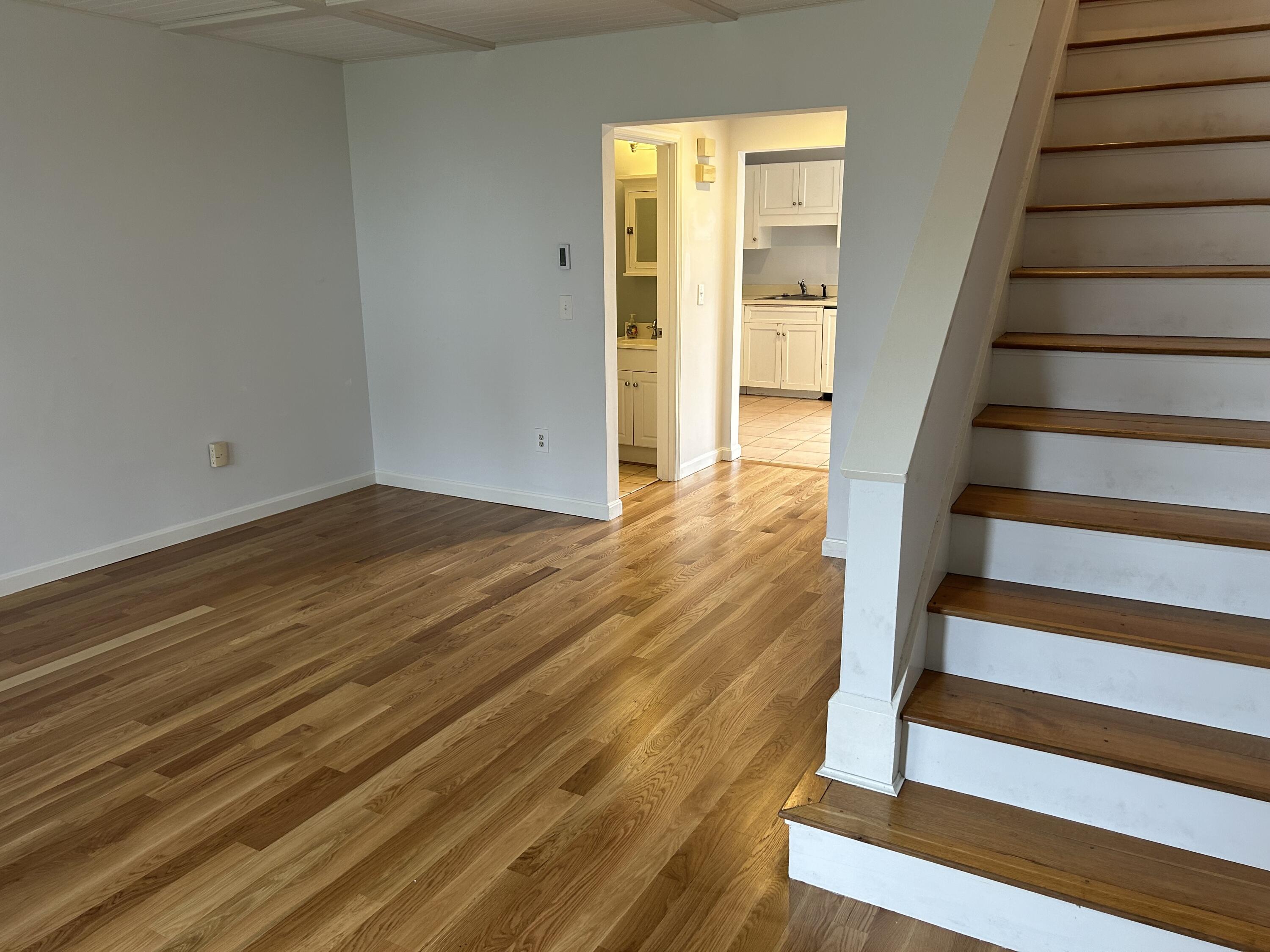 48 Camp Street, Unit 9 Hyannis, MA 02601 - Photo 29 of 42 a view of entryway with wooden floor and stairs