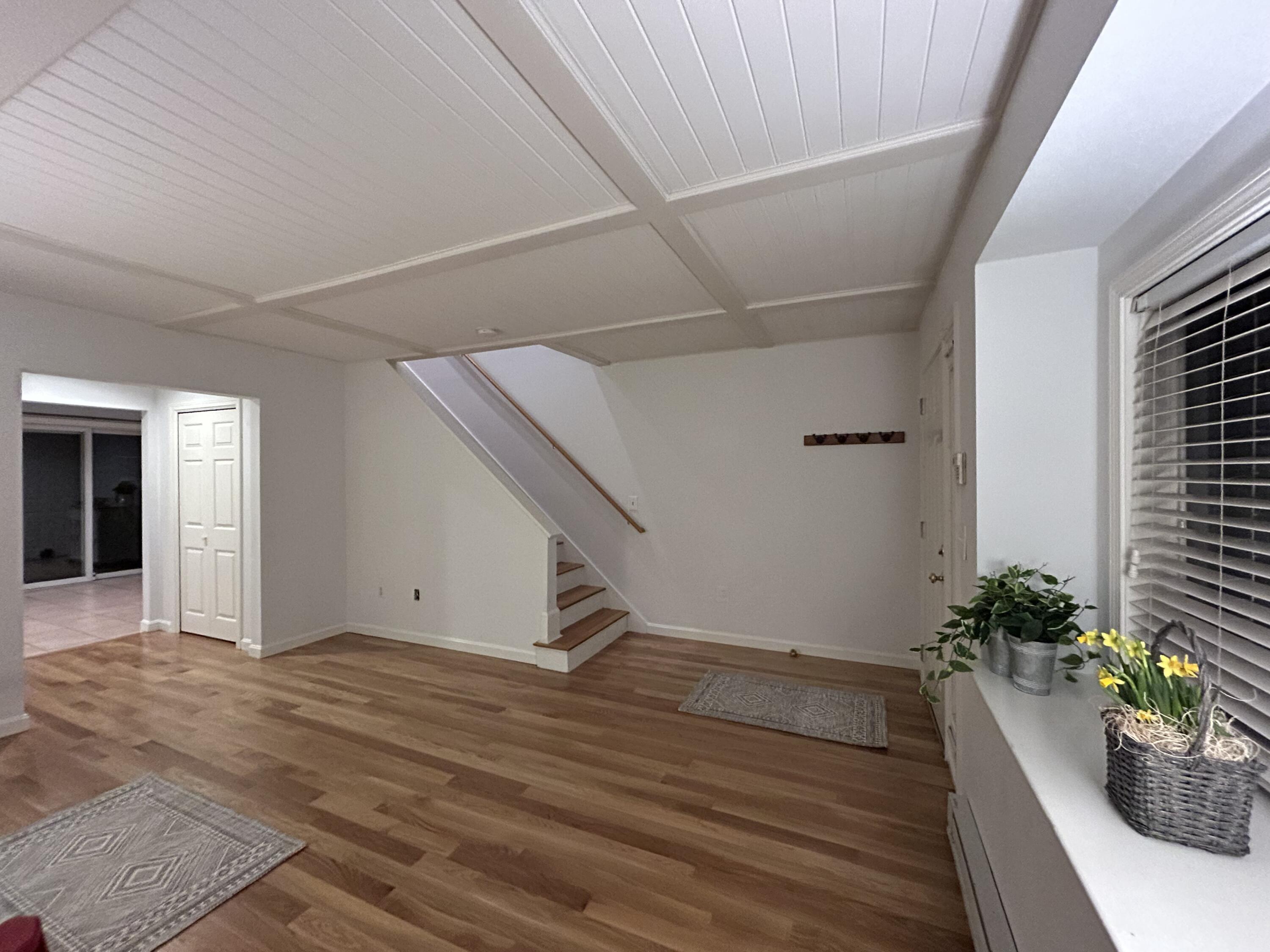 48 Camp Street, Unit 9 Hyannis, MA 02601 - Photo 32 of 42 a view of an entryway with wooden floor and potted plants