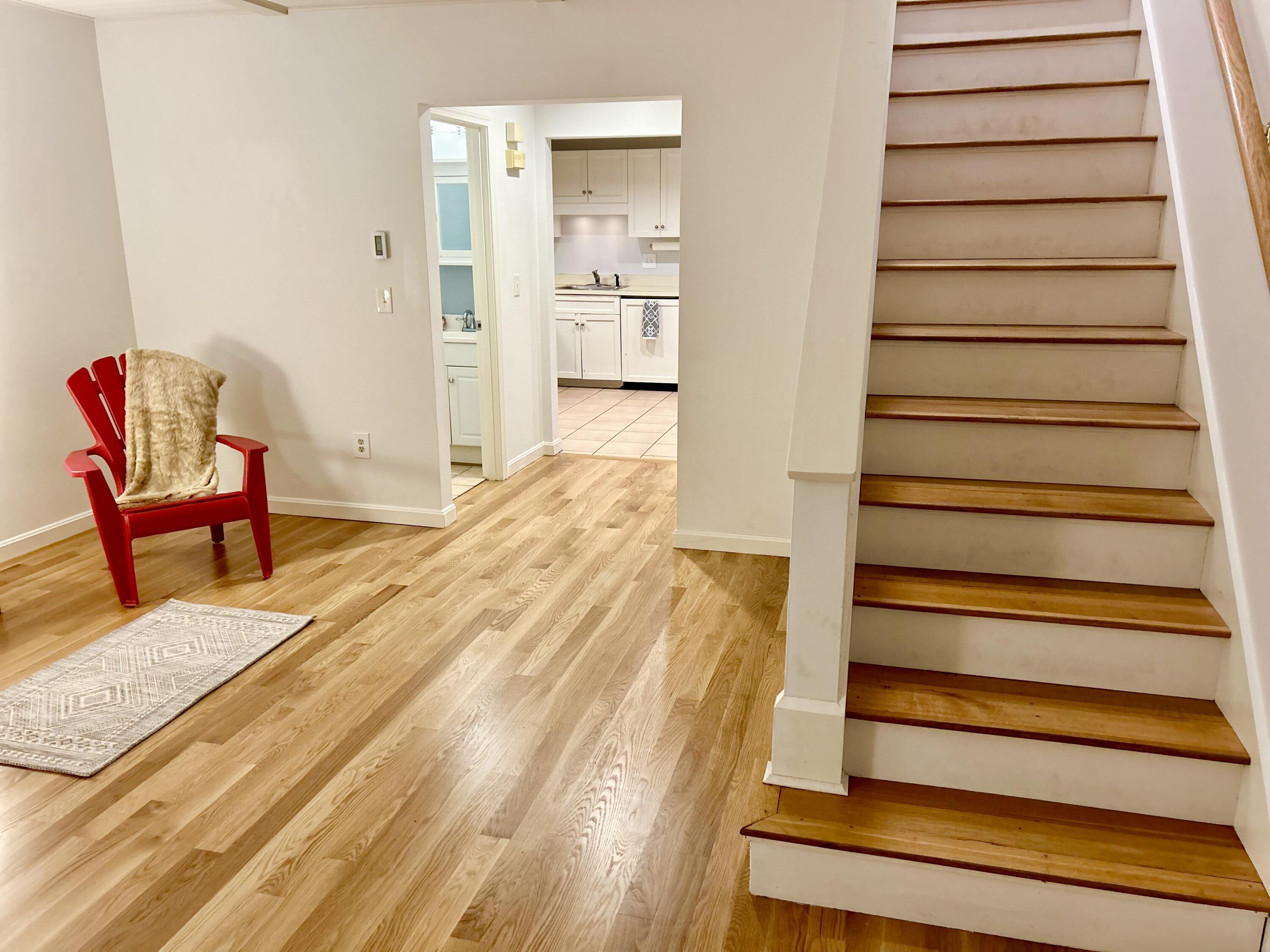 48 Camp Street, Unit 9 Hyannis, MA 02601 - Photo 4 of 42 a bedroom with a bed and chair