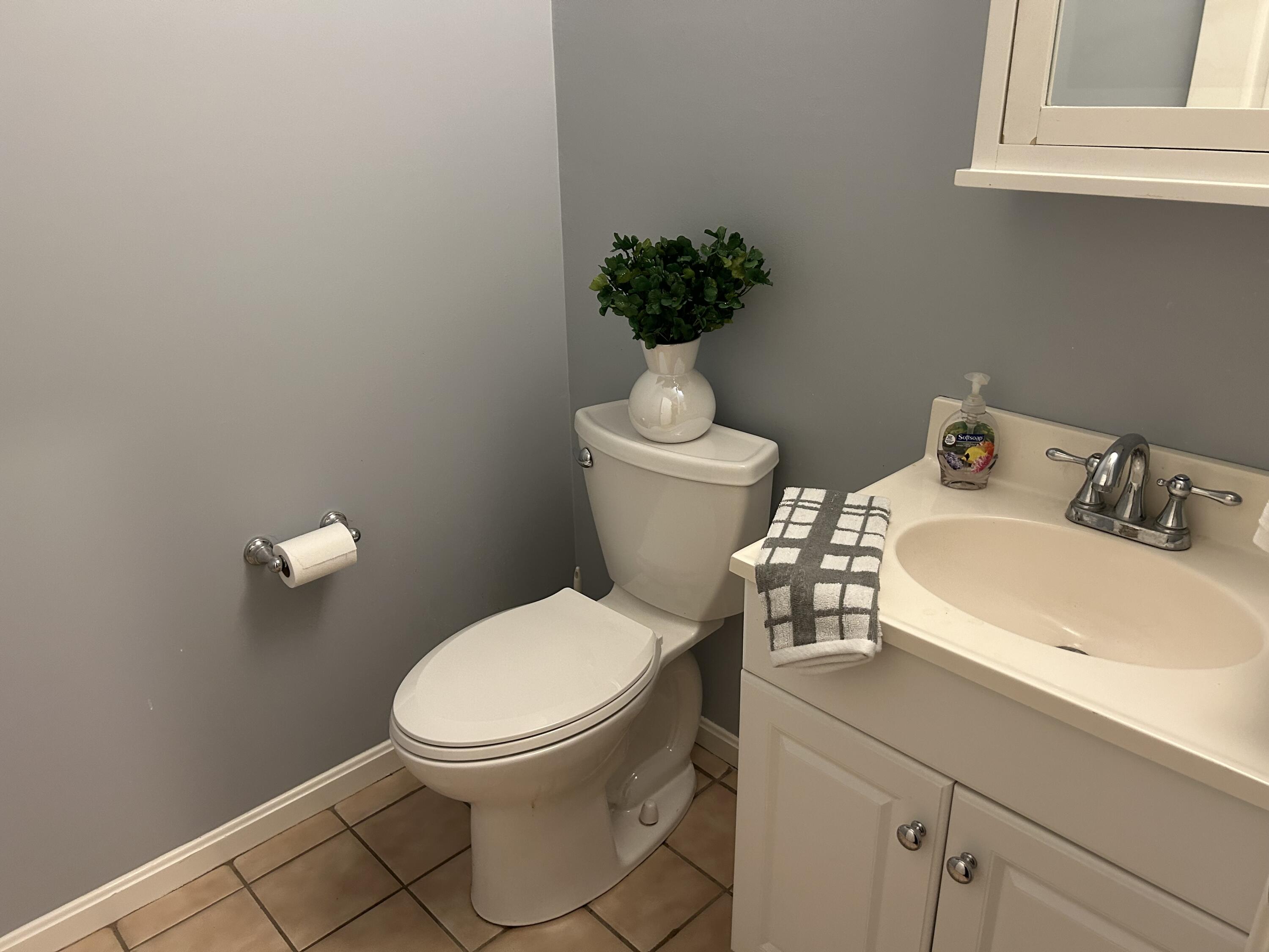 48 Camp Street, Unit 9 Hyannis, MA 02601 - Photo 6 of 42 a bathroom with a sink and a toilet