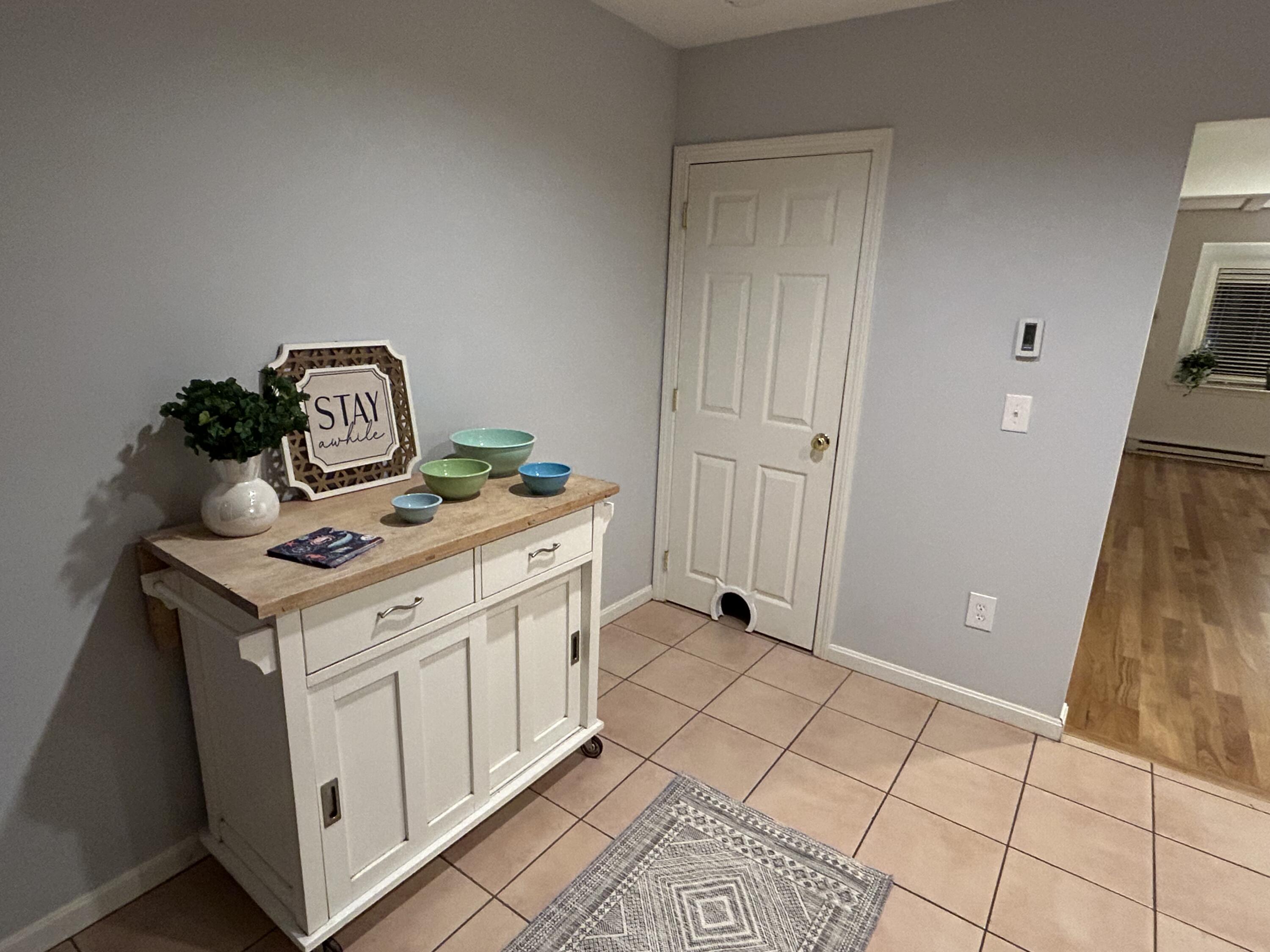 48 Camp Street, Unit 9 Hyannis, MA 02601 - Photo 10 of 42 a kitchen with a stove and a refrigerator