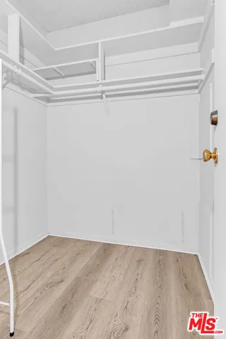 a view of an empty walk in closet