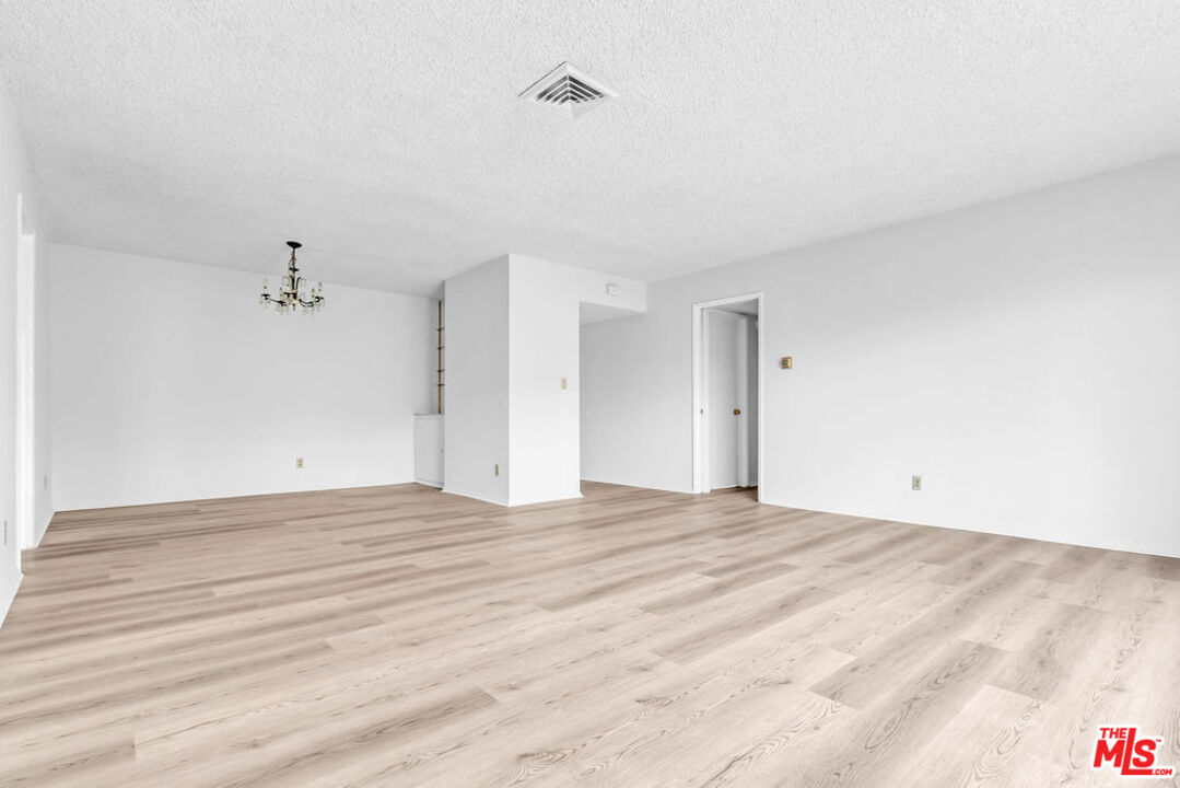 732 Lorraine Boulevard, Unit 5 Los Angeles, CA 90005 - Photo 21 of 25 a view of an empty room with a window