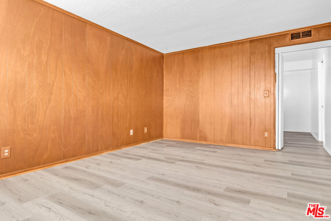 732 Lorraine Boulevard, Unit 5 Los Angeles, CA 90005 - Photo 9 of 25 a view of an empty room with wooden floor