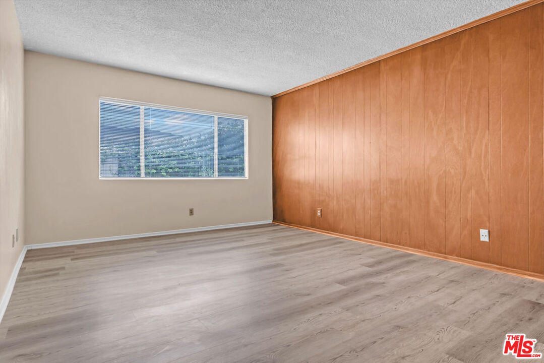 732 Lorraine Boulevard, Unit 5 Los Angeles, CA 90005 - Photo 10 of 25 an empty room with windows