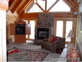 306 Dark Corner Road Rutherfordton, NC 28139 - Photo 6 of 9 a living room with furniture a window and a fireplace