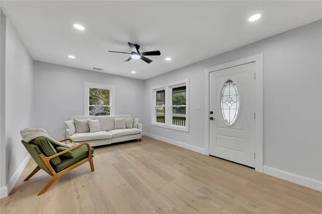 a living room with furniture and a window