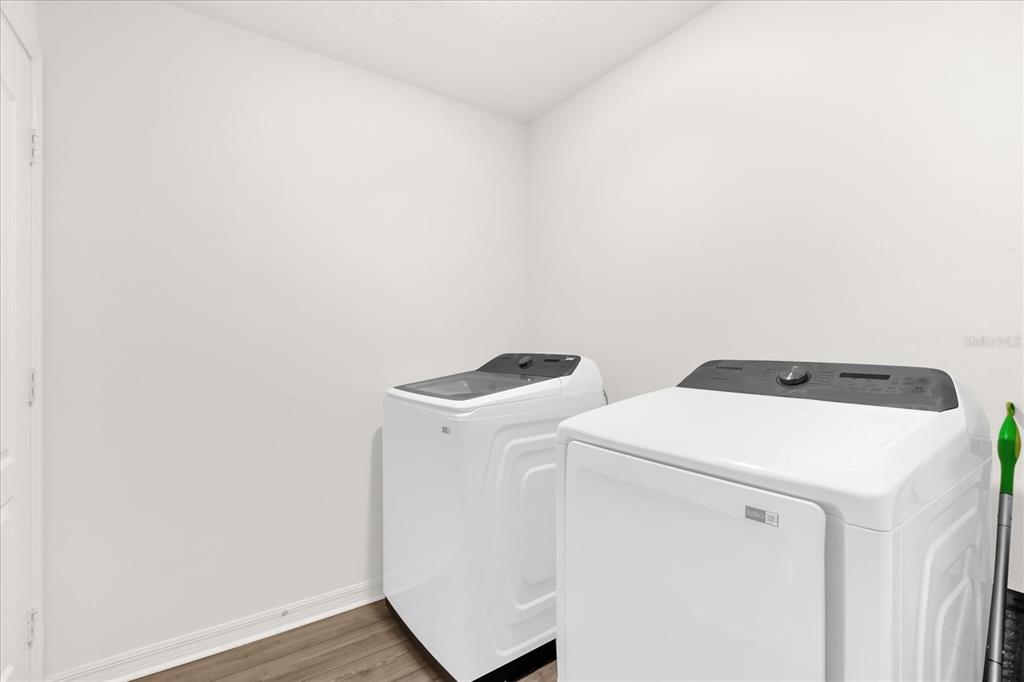 2134 Rio Grande Canyon Loop Poinciana, FL 34759 - Photo 16 of 22 a utility room with dryer and washer