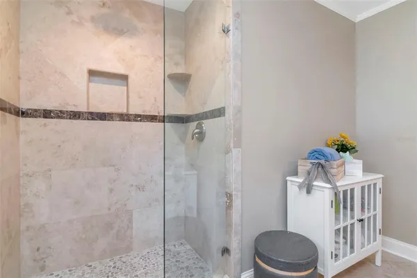 a spacious bathroom with a tub sink and mirror