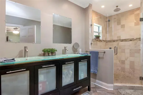 a view of a bathroom with mirror
