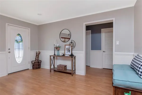 a room with wooden floor and a window