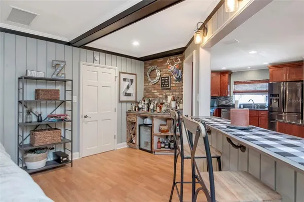 a kitchen with stainless steel appliances granite countertop a refrigerator and a stove top oven