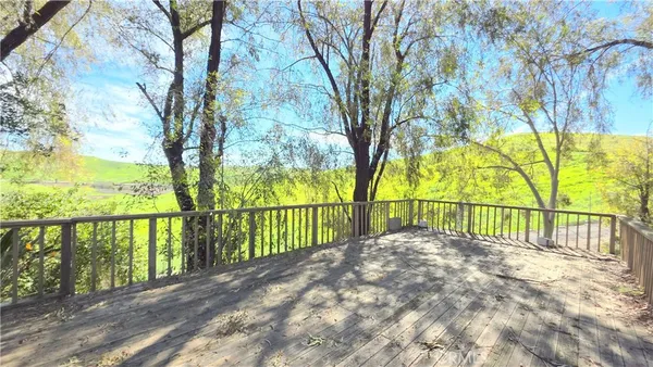a view of balcony with a small yard