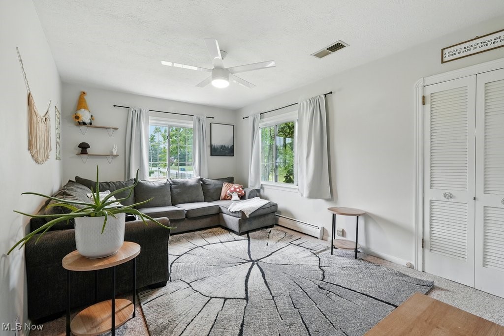 1624 Krumroy Road Akron, OH 44306 - Photo 12 of 47 Living room with a baseboard radiator and a ceiling fan