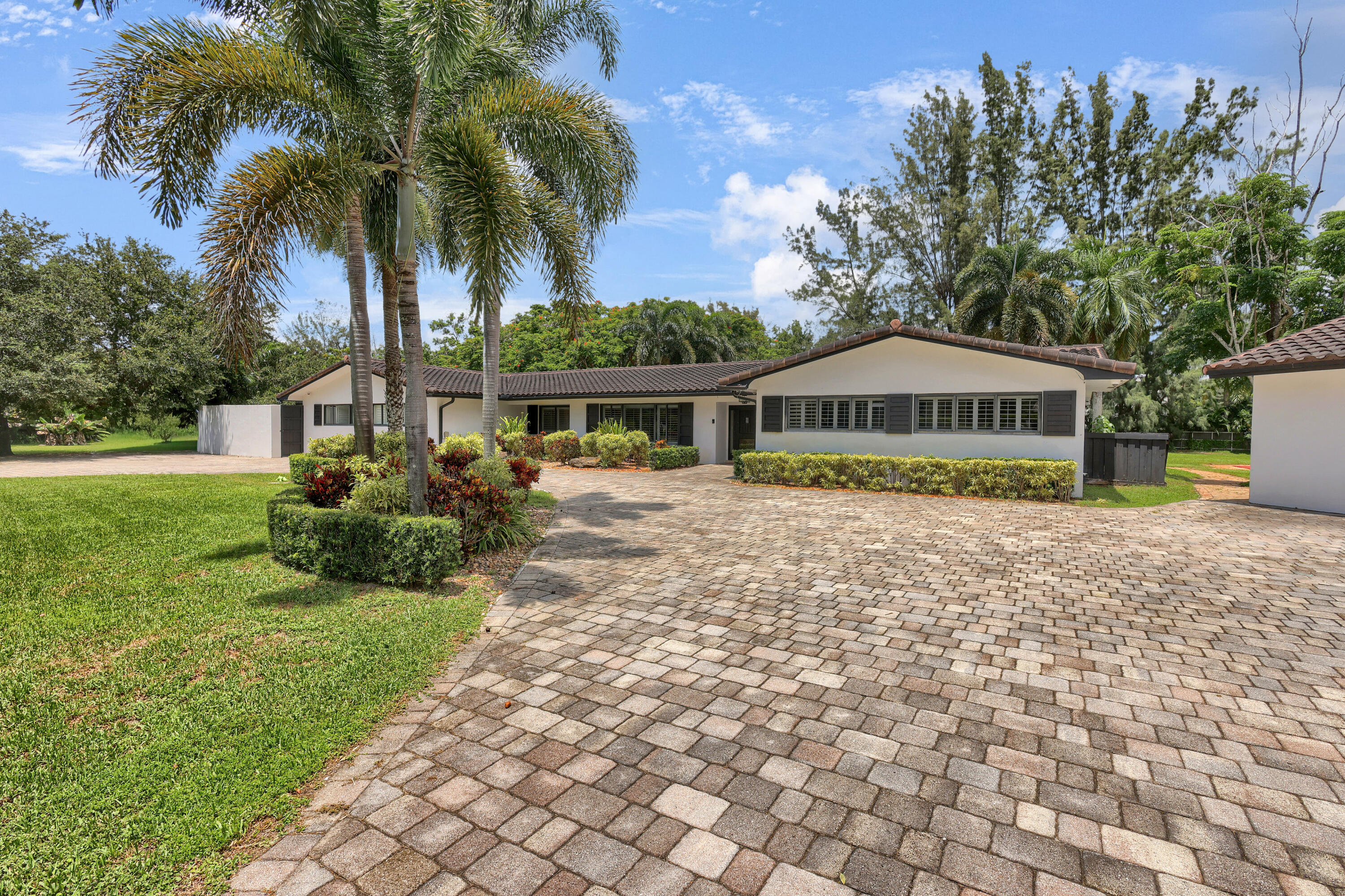 14701 Southwest 63rd Street Southwest Ranches, FL 33330 - Photo 1 of 47 a view of a house with a yard