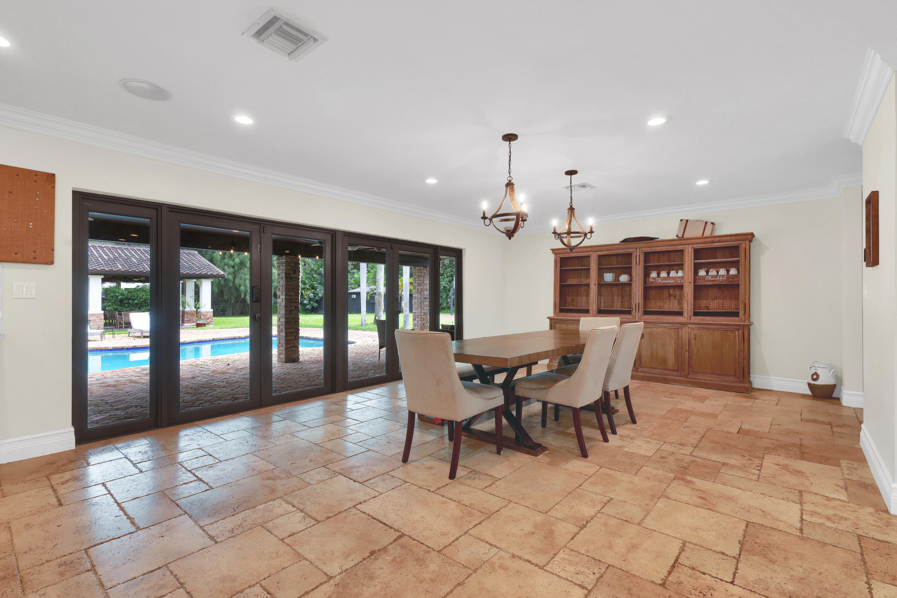 14701 Southwest 63rd Street Southwest Ranches, FL 33330 - Photo 15 of 47 a dining room with furniture and wooden floor