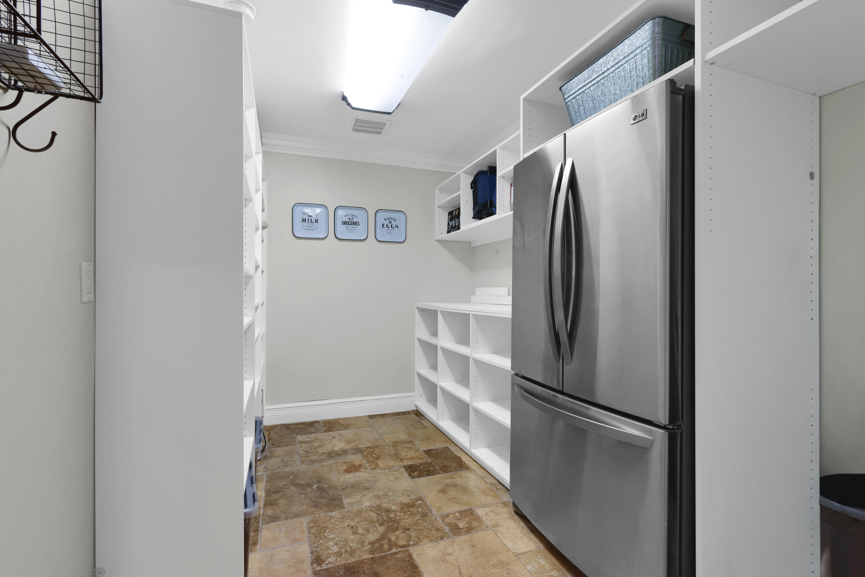 14701 Southwest 63rd Street Southwest Ranches, FL 33330 - Photo 16 of 47 a white refrigerator freezer and a stove sitting inside of a kitchen