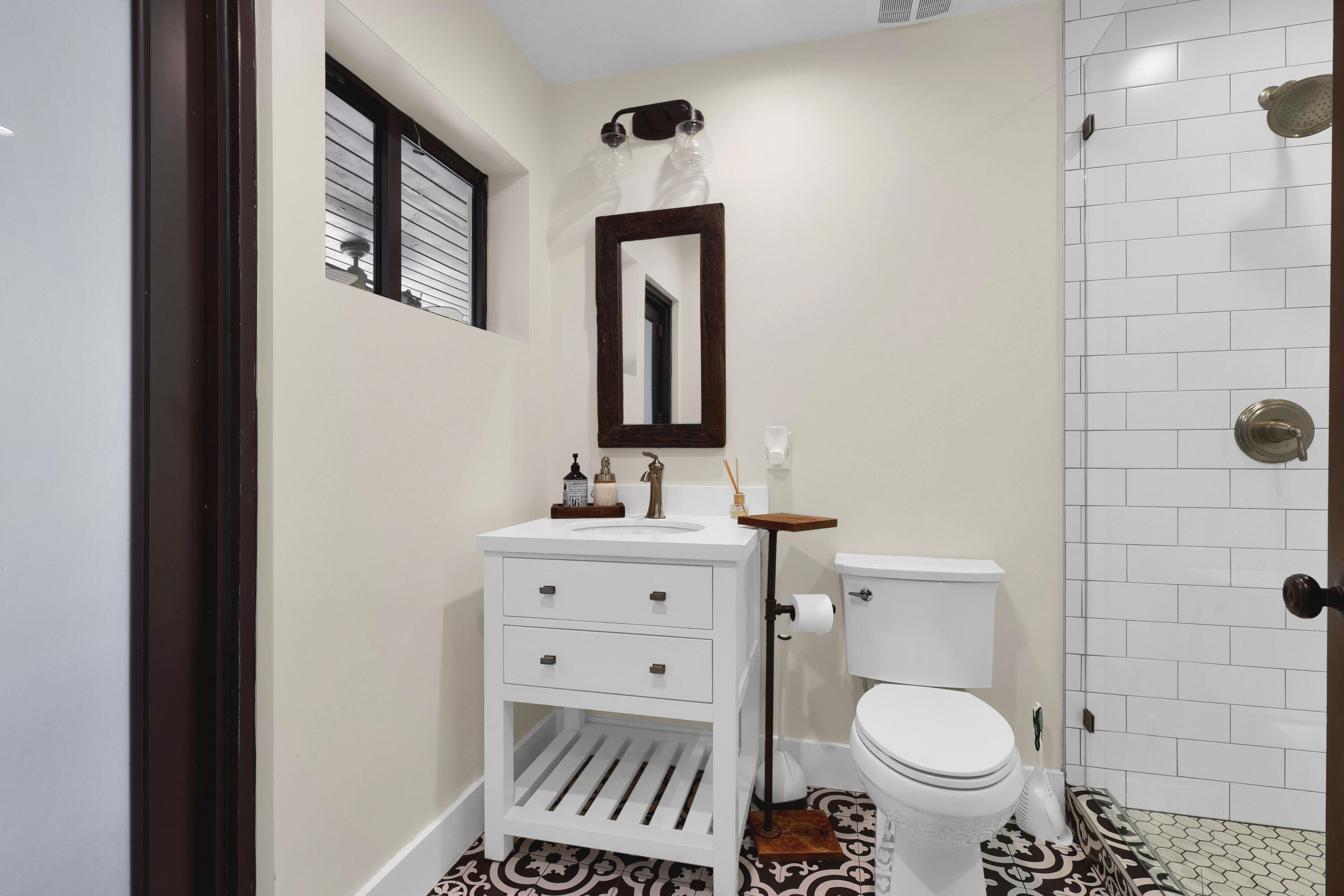 14701 Southwest 63rd Street Southwest Ranches, FL 33330 - Photo 17 of 47 a bathroom with a toilet a sink and mirror