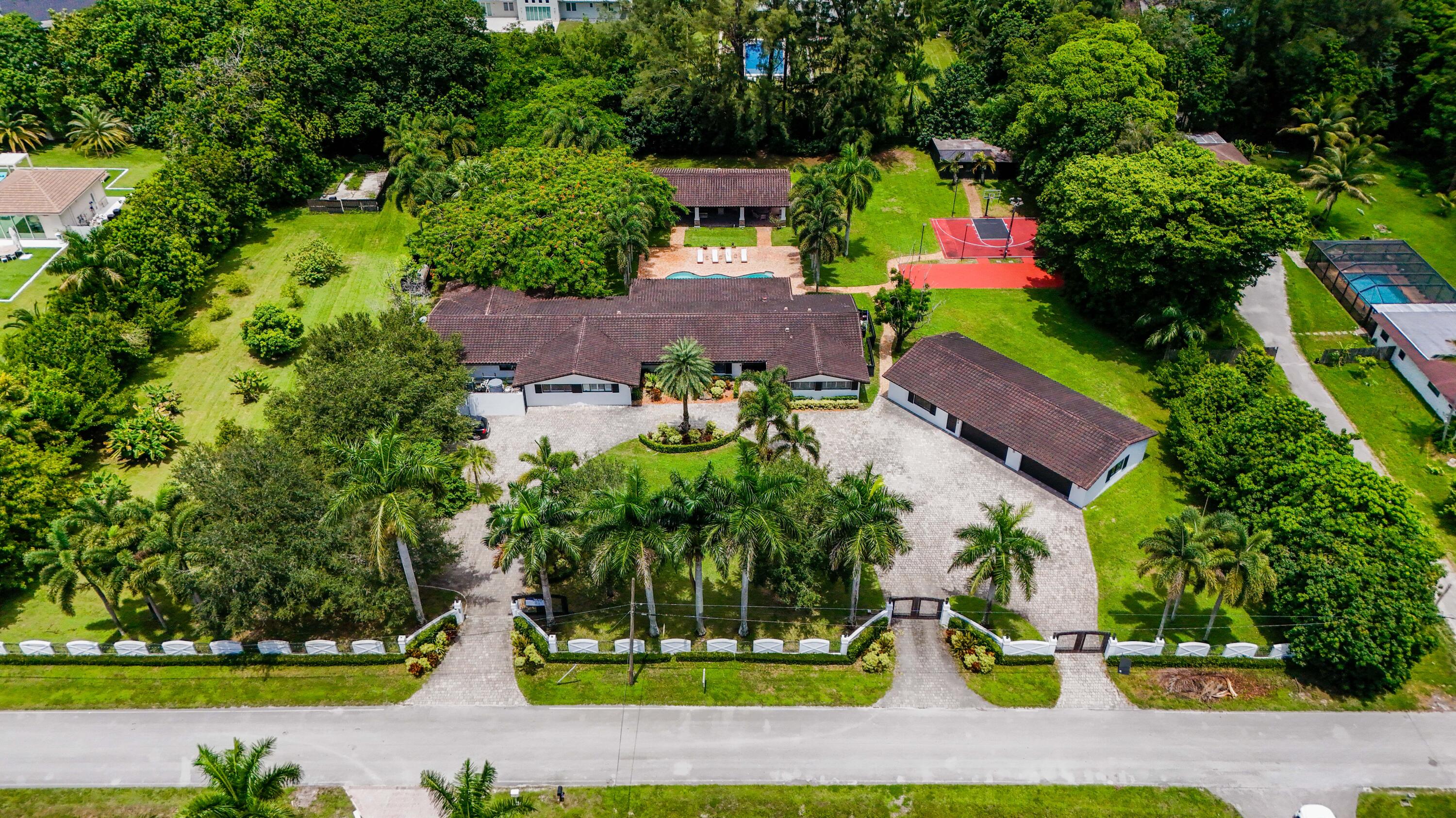 14701 Southwest 63rd Street Southwest Ranches, FL 33330 - Photo 43 of 47 an aerial view of a house with a yard