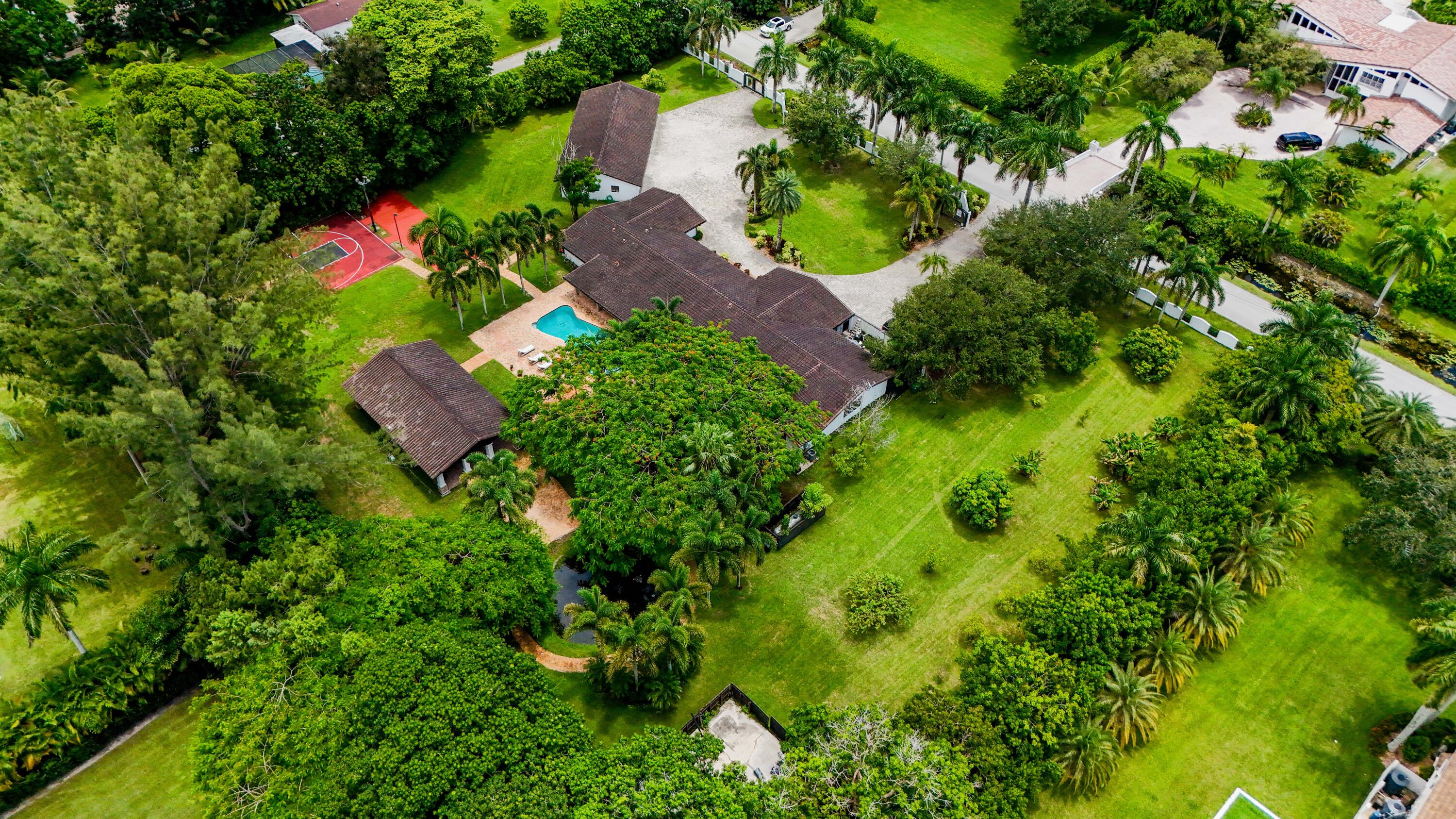 14701 Southwest 63rd Street Southwest Ranches, FL 33330 - Photo 45 of 47 an aerial view of residential house with outdoor space and trees all around
