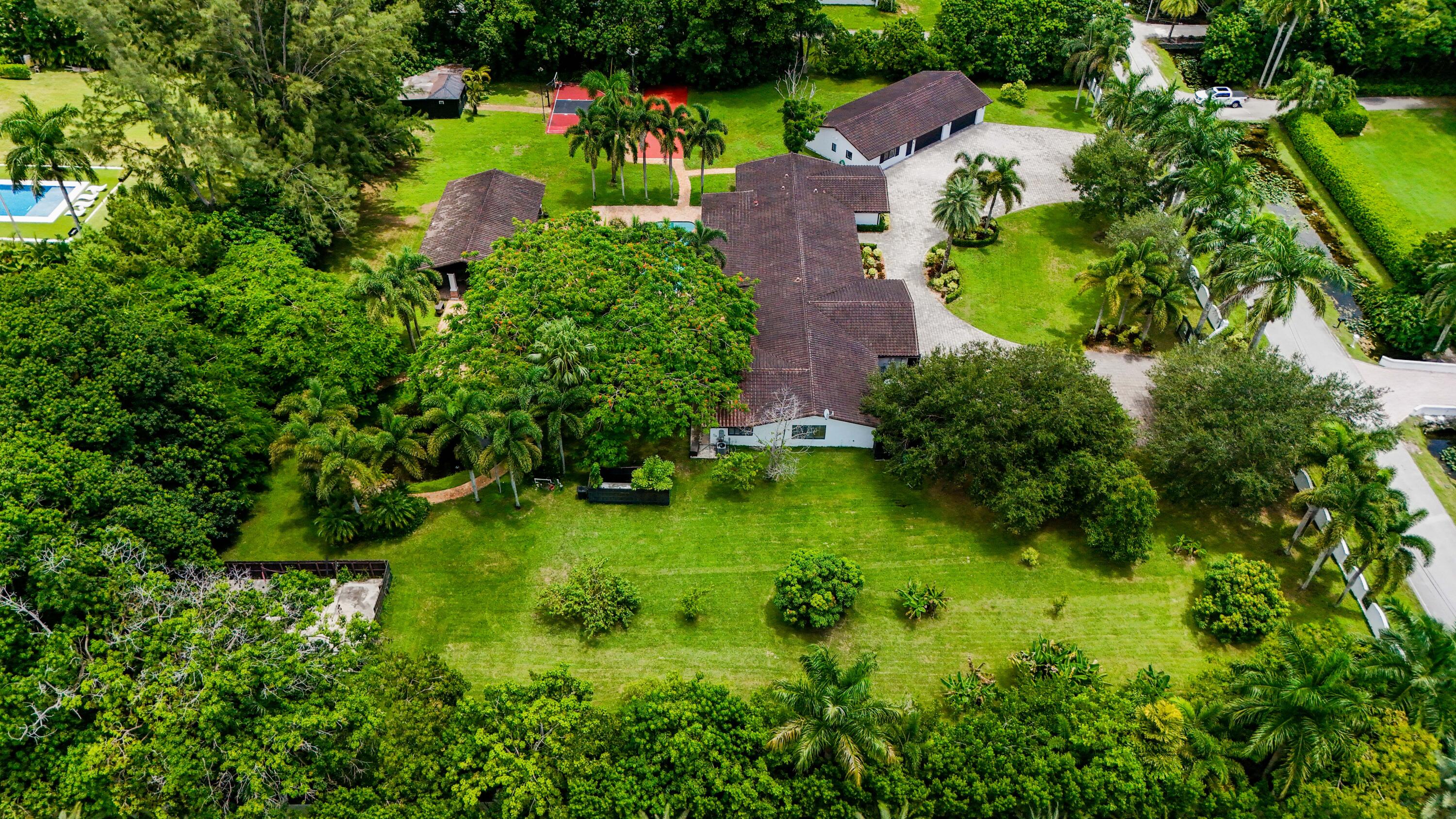 14701 Southwest 63rd Street Southwest Ranches, FL 33330 - Photo 46 of 47 an aerial view of residential house with outdoor space and trees all around