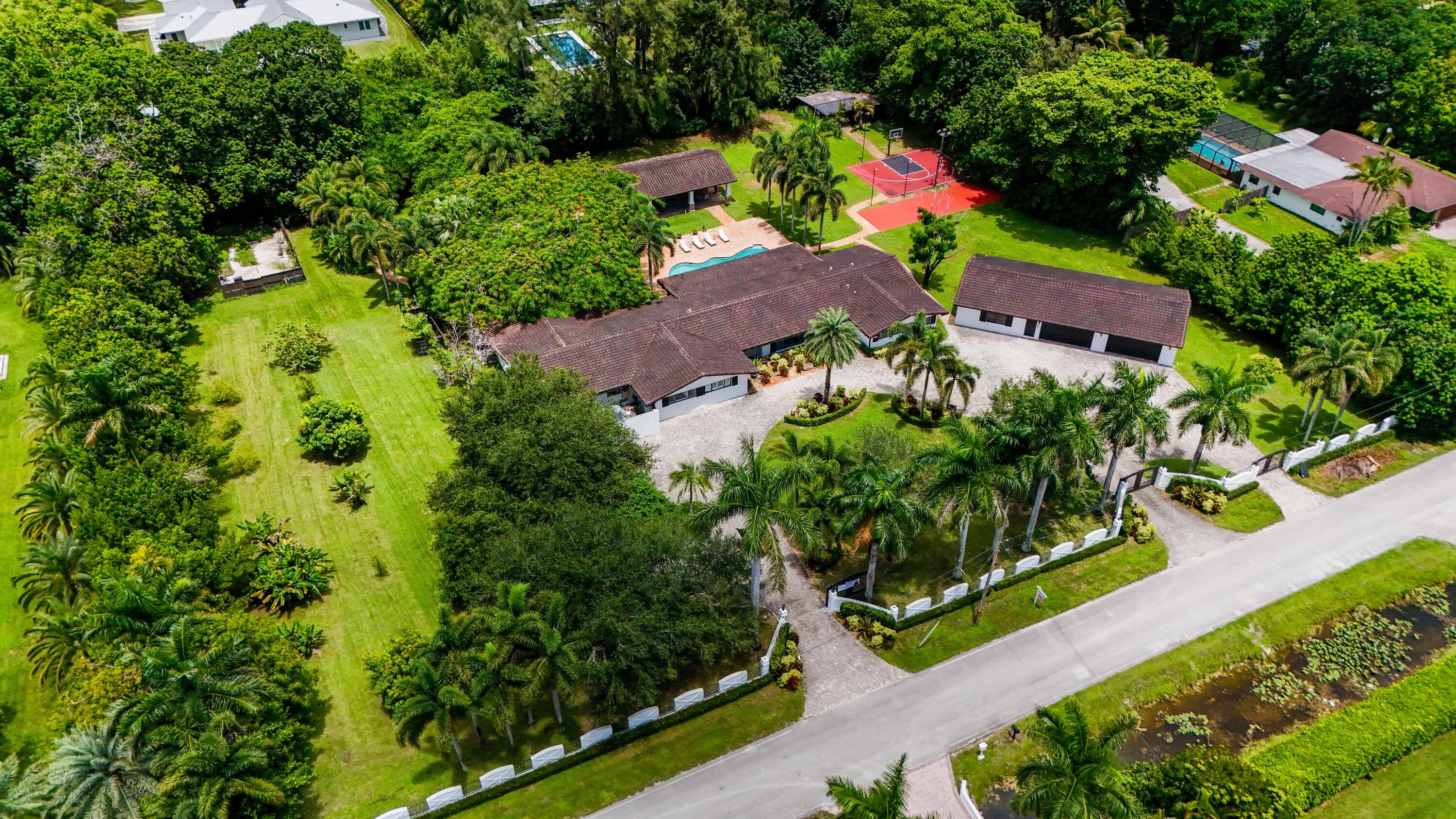 14701 Southwest 63rd Street Southwest Ranches, FL 33330 - Photo 47 of 47 an aerial view of residential house with outdoor space and trees all around