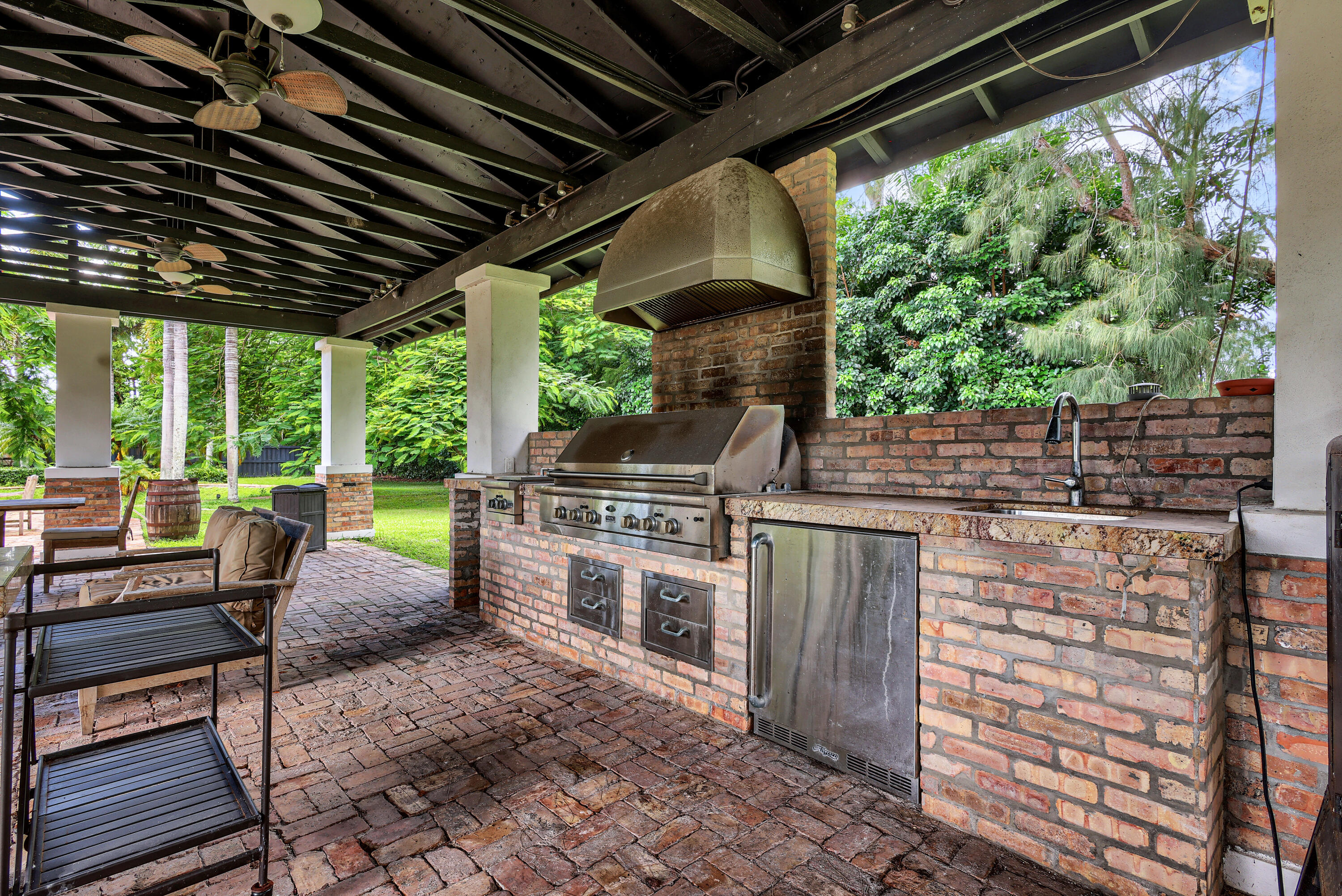 14701 Southwest 63rd Street Southwest Ranches, FL 33330 - Photo 7 of 47 a view of a chairs and table in the patio
