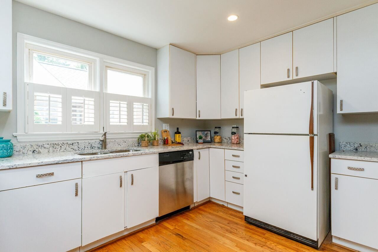 3018 Medlin Drive Raleigh, NC 27607 - Photo 14 of 30 Open kitchen layout has lots of storage space, and a lazy susan cabinet Kitchen