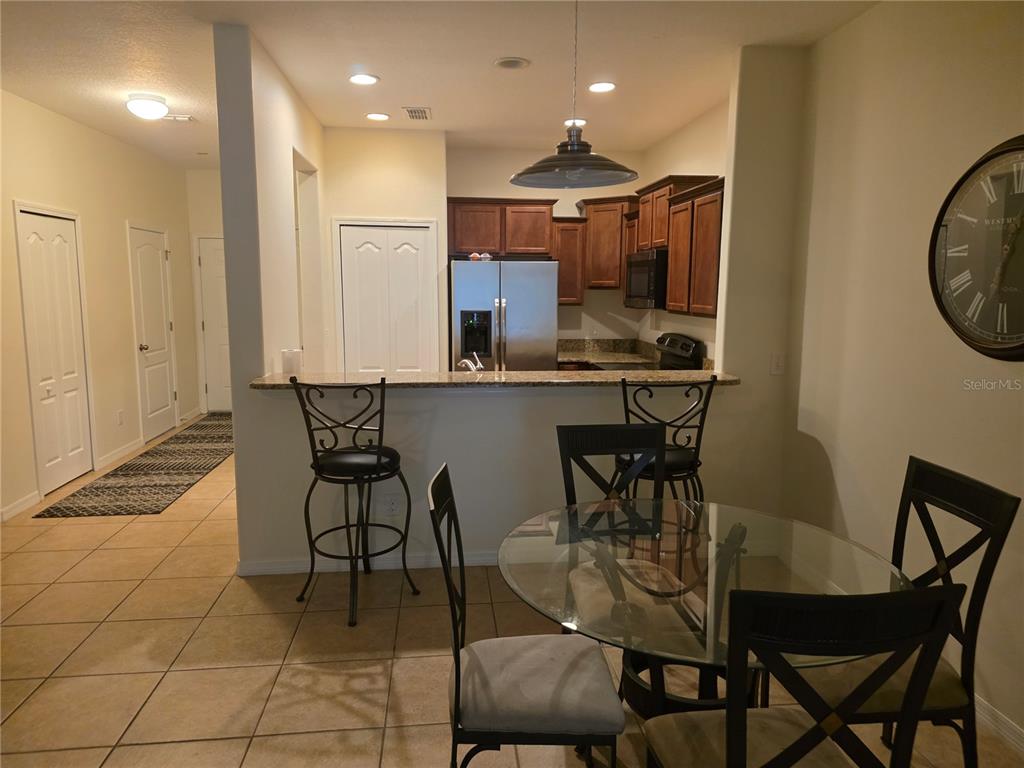 3158 Rodrick Circle Orlando, FL 32824 - Photo 7 of 17 a view of a dining room with furniture