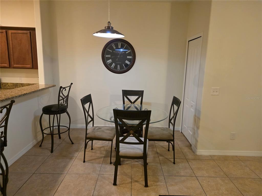 3158 Rodrick Circle Orlando, FL 32824 - Photo 8 of 17 a view of a dinning room with furniture and front door