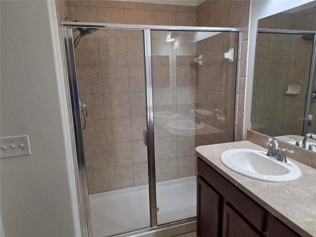 3158 Rodrick Circle Orlando, FL 32824 - Photo 10 of 17 a bathroom with a shower and a sink