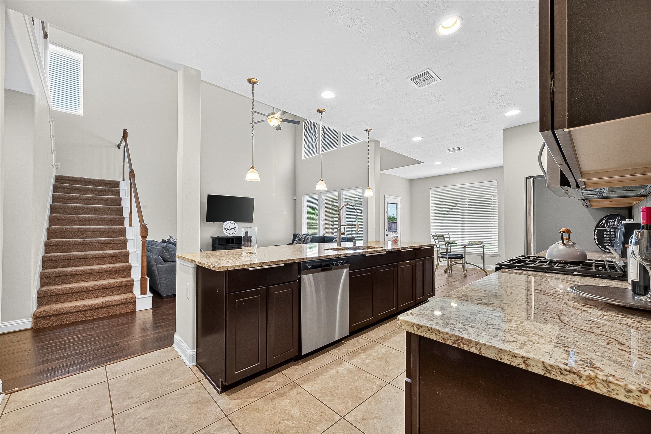 8107 Lockridge Terrace Lane Cypress, TX 77433 - Photo 16 of 50 This open-concept kitchen connects effortlessly to the living and dining spaces, creating a natural flow for both entertaining and everyday life.