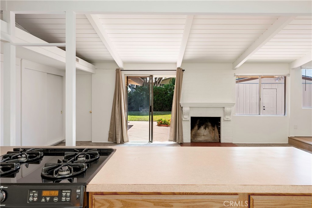 3357 Roxanne Avenue Long Beach, CA 90808 - Photo 34 of 52 a view of a kitchen with a large window and a fireplace