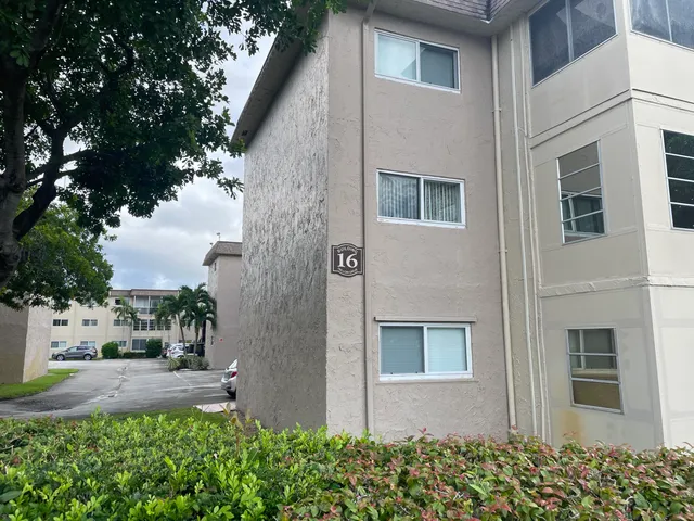 a hallway with front door and wooden floor