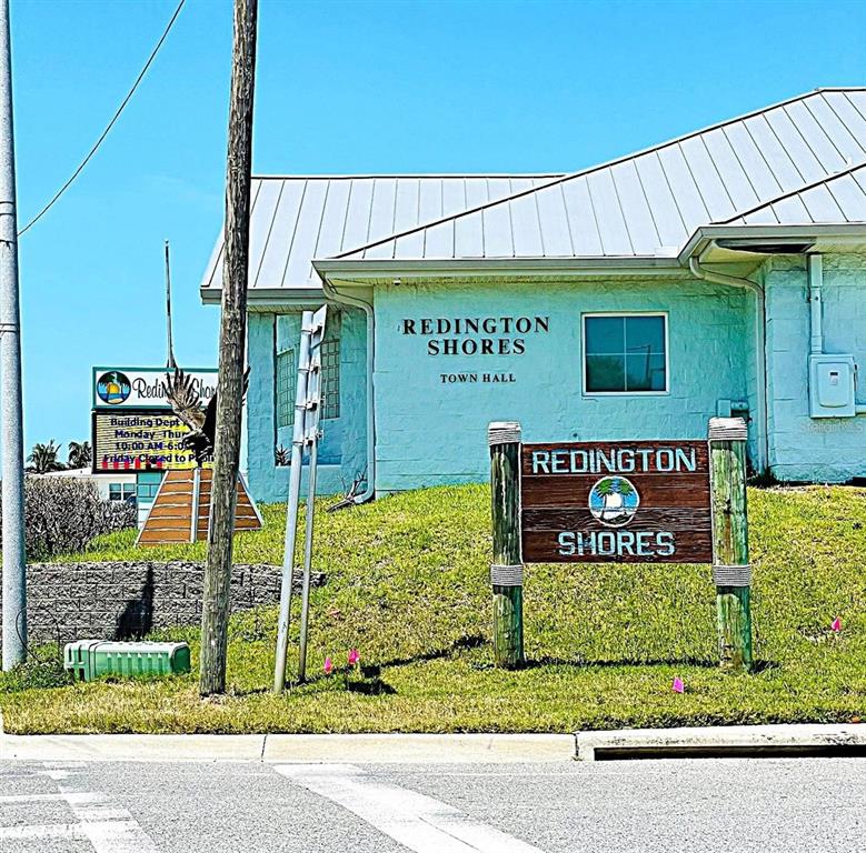 113 174th Avenue East Redington Shores, FL 33708 - Photo 15 of 16 a sign on the side of a building