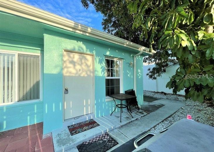 113 174th Avenue East Redington Shores, FL 33708 - Photo 3 of 16 a view of backyard with a patio and outdoor seating