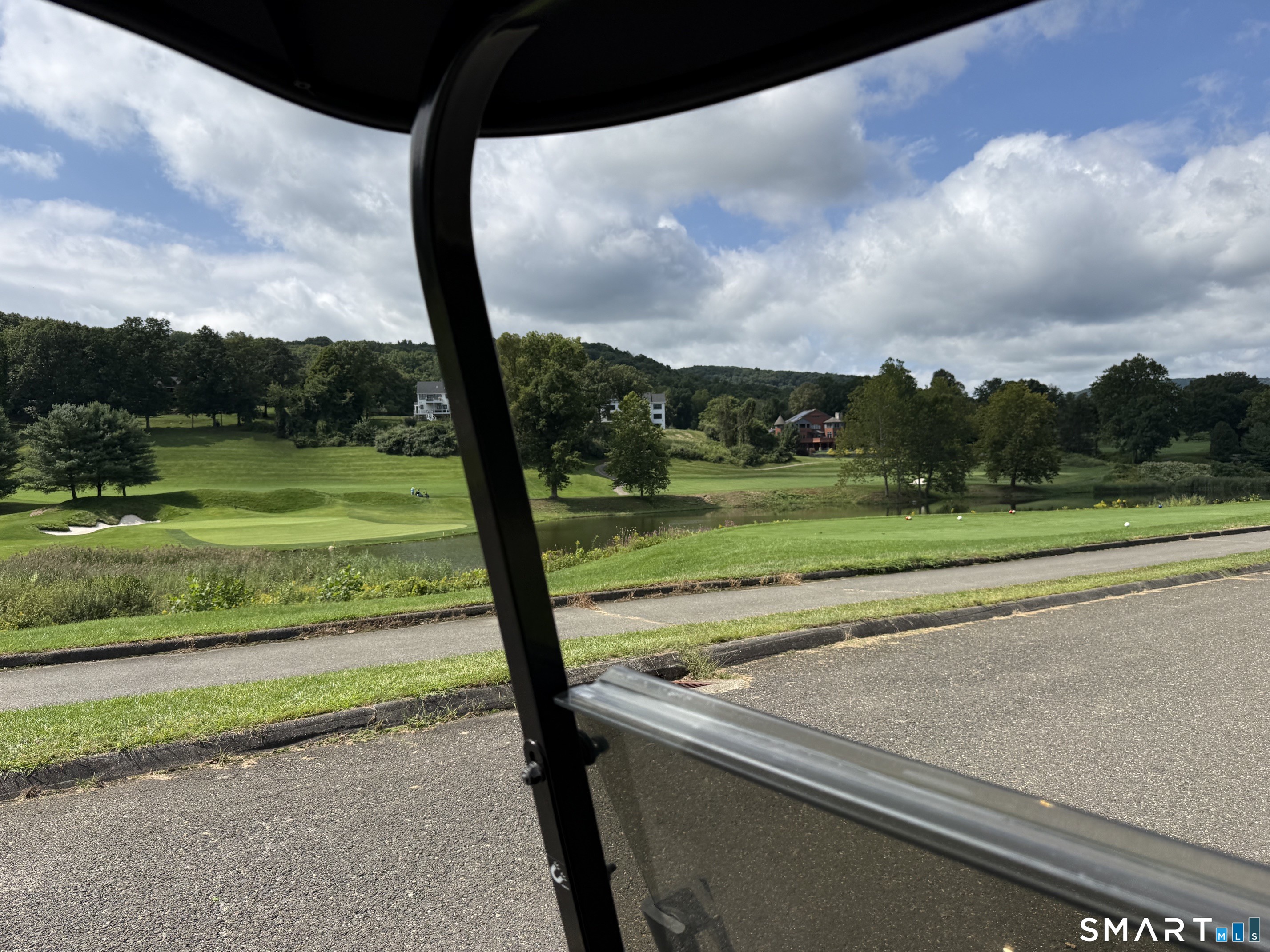 97 Long River Road Sherman, CT 06784 - Photo 4 of 29 Golf cart view of the pond across from the two acre lot